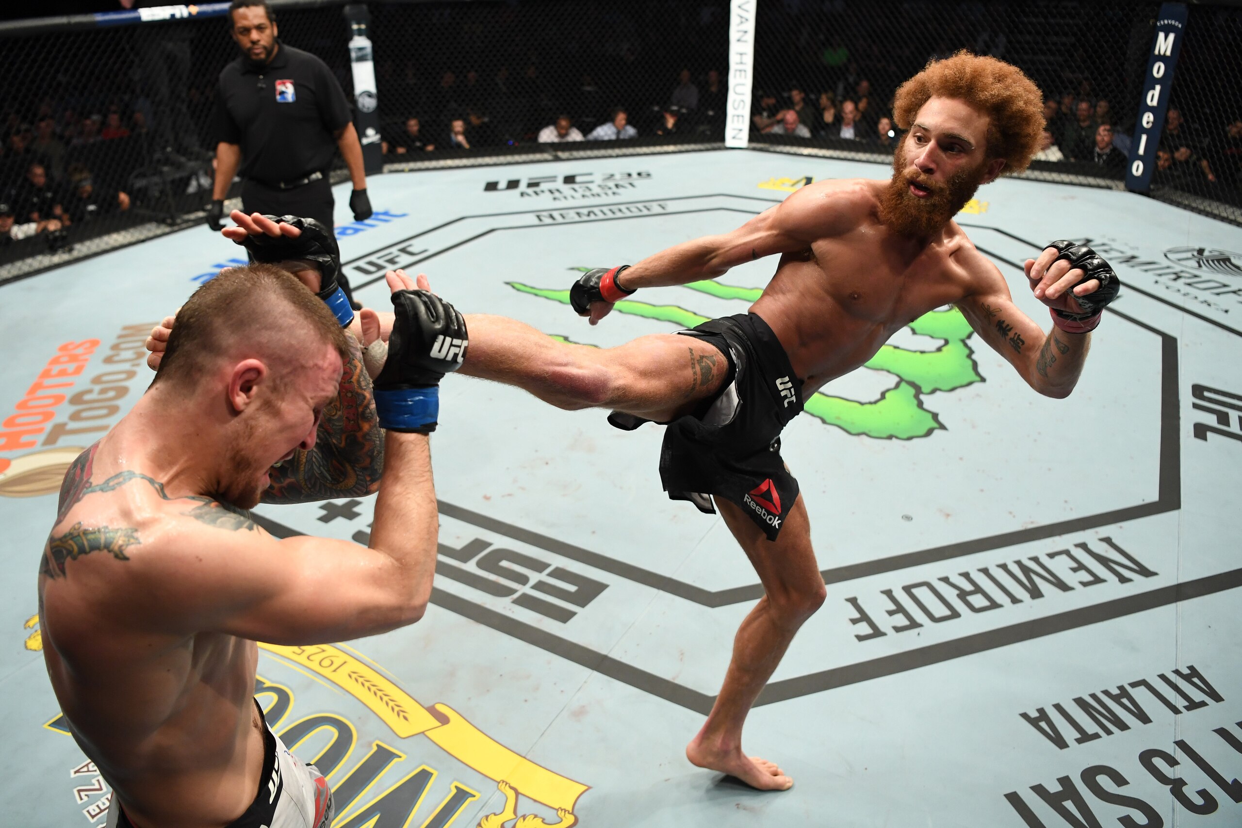NASHVILLE, TENNESSEE - MARCH 23:  (R-L) Luis Pena kicks Steven Peterson in their featherweight bout during the UFC Fight Night event at Bridgestone Arena on March 23, 2019 in Nashville, Tennessee. (Photo by Jeff Bottari/Zuffa LLC/Zuffa LLC via Getty Image