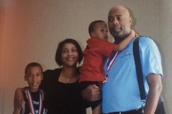 R.J. Hampton in his preteen years with his mother, Markita, his little brother, Ryan, and his father, Rod.