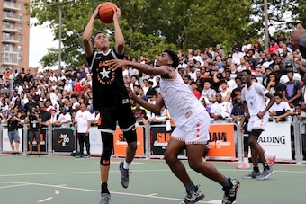 NEW YORK, NY - AUGUST 18:  RJ Hampton #5 of Team Ramsey heads for the net as Josh Christopher #3 of Team Stanley defends during the SLAM Summer Classic 2018 at Dyckman Park on August 18, 2018 in New York City.  (Photo by Elsa/Getty Images)