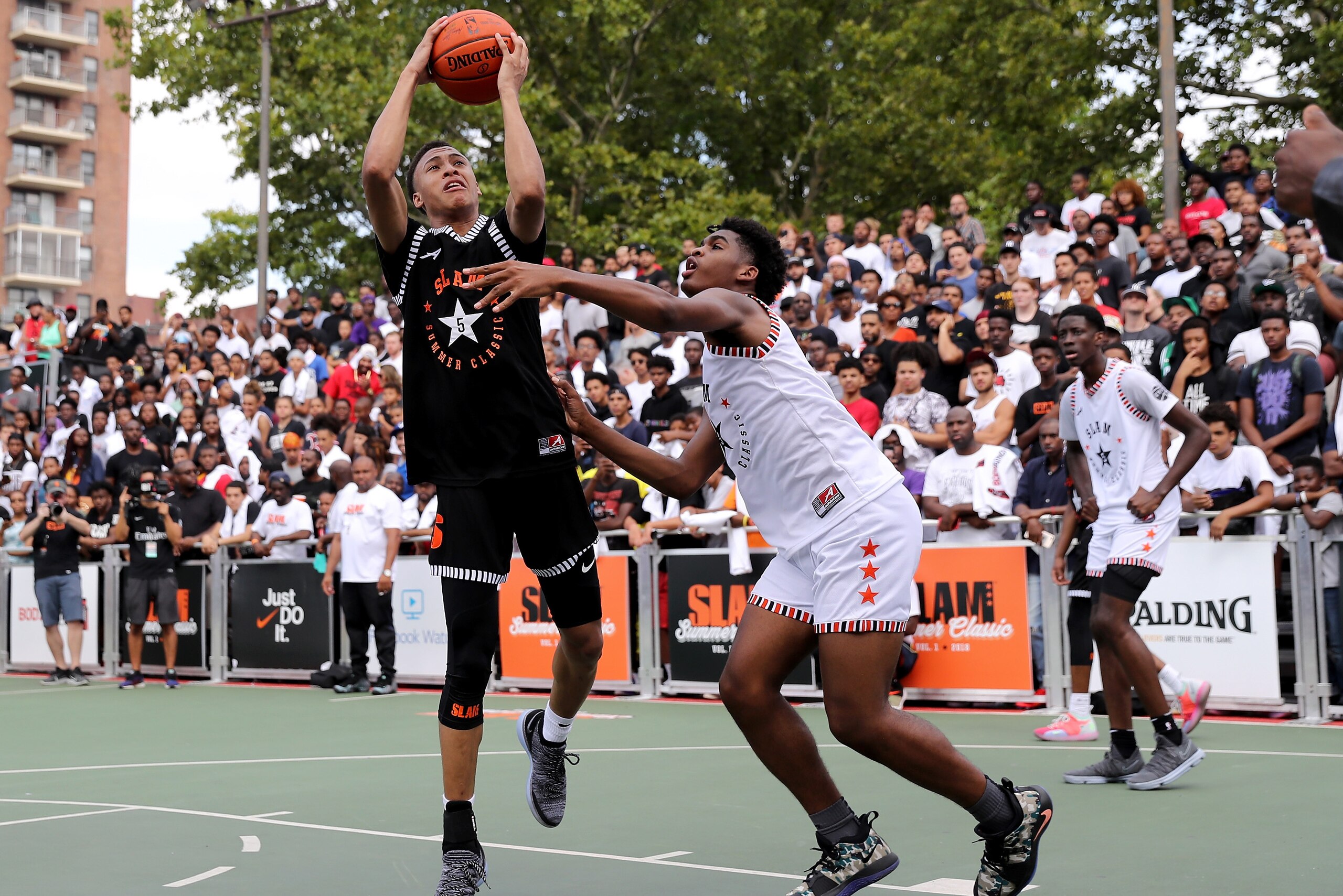NEW YORK, NY - AUGUST 18:  RJ Hampton #5 of Team Ramsey heads for the net as Josh Christopher #3 of Team Stanley defends during the SLAM Summer Classic 2018 at Dyckman Park on August 18, 2018 in New York City.  (Photo by Elsa/Getty Images)