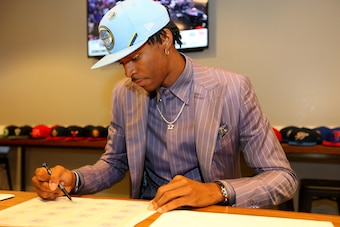 BROOKLYN, NY - JUNE 20: Ja Morant signs autographs after being selected second overall by the Memphis Grizzlies during the 2019 NBA Draft on June 20, 2019 at the Barclays Center in Brooklyn, New York. NOTE TO USER: User expressly acknowledges and agrees t BROOKLYN, NY - JUNE 20: Ja Morant signs autographs after being selected second overall by the Memphis Grizzlies during the 2019 NBA Draft on June 20, 2019 at the Barclays Center in Brooklyn, New York. NOTE TO USER: User expressly acknowledges and agrees t