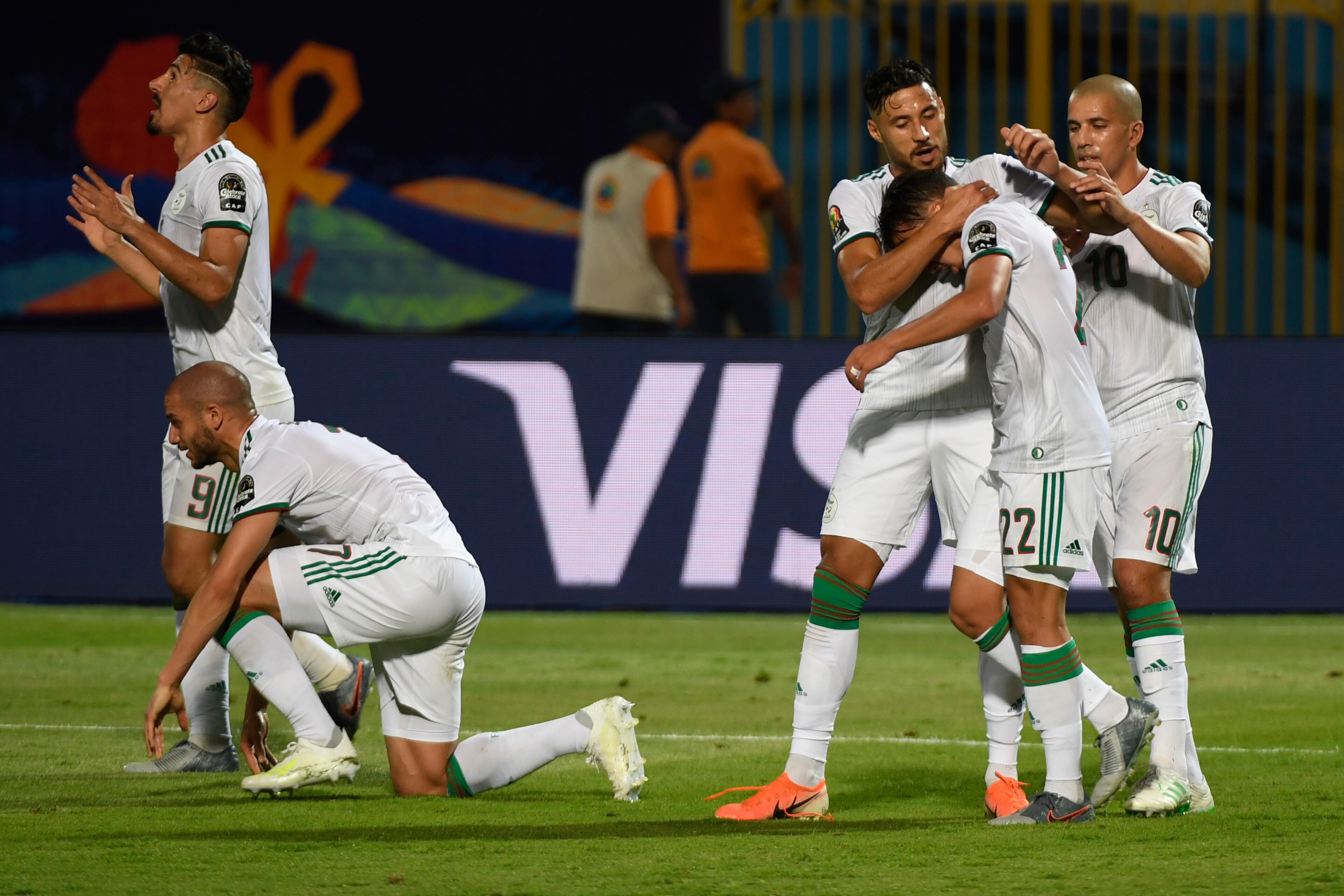 Algeria's forward Baghdad Bounedjah (3rd-R) congratulates Algeria's midfielder Ismail Bennacer for his assist during the 2019 Africa Cup of Nations (CAN) football match between Algeria and Kenya at the 30 June Stadium in Cairo on June 23, 2019. (Photo by 