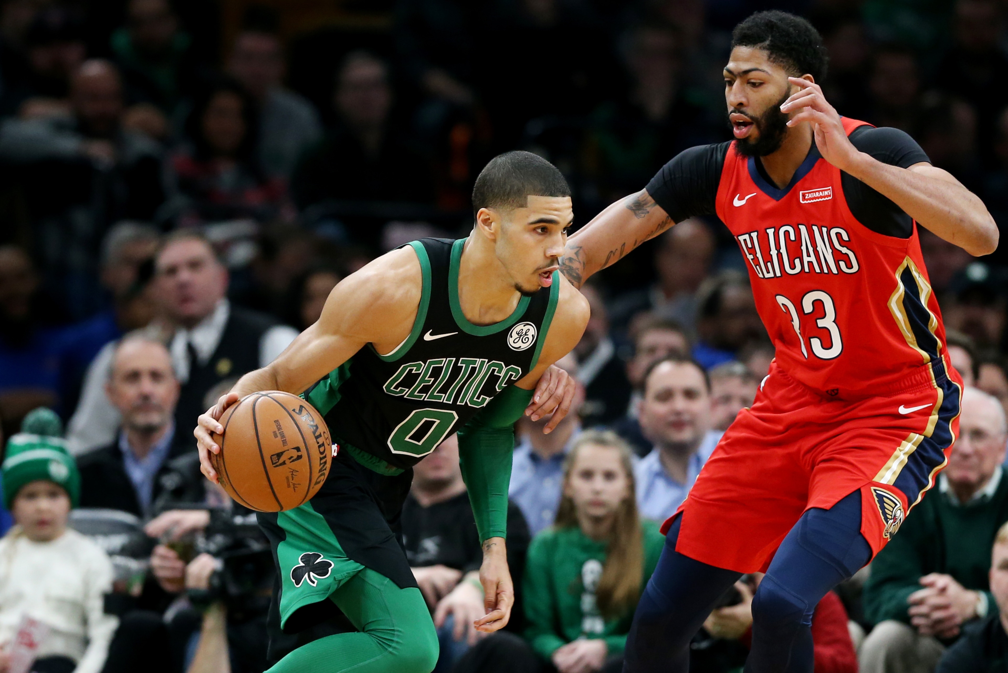BOSTON, MA - DECEMBER 10: Jayson Tatum #0 of the Boston Celtics drives against Anthony Davis #23 of the New Orleans Pelicans at TD Garden on December 10, 2018 in Boston, Massachusetts. (Photo by Maddie Meyer/Getty Images)