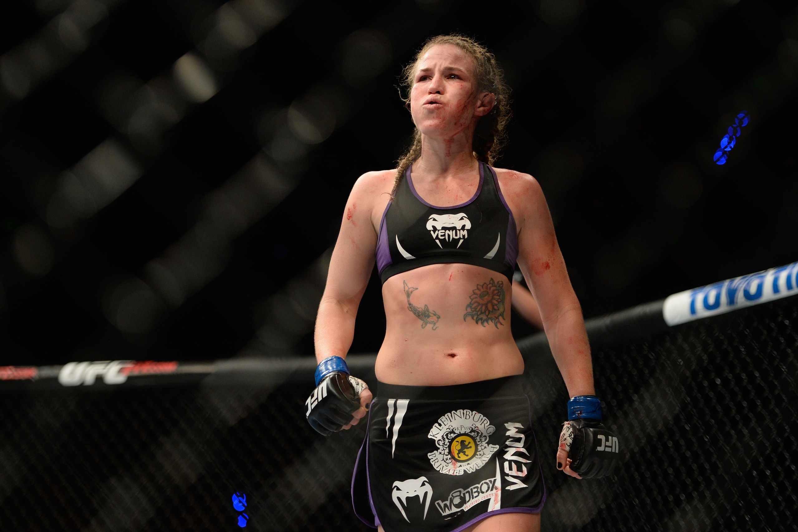 MEXICO CITY, MEXICO - NOVEMBER 15:  Leslie Smith walks to her corner after her fight against Jessic Eye was called due to her ear being damaged in their women's bantamweight bout during the UFC 180 event at Arena Ciudad de Mexico on November 15, 2014 in M