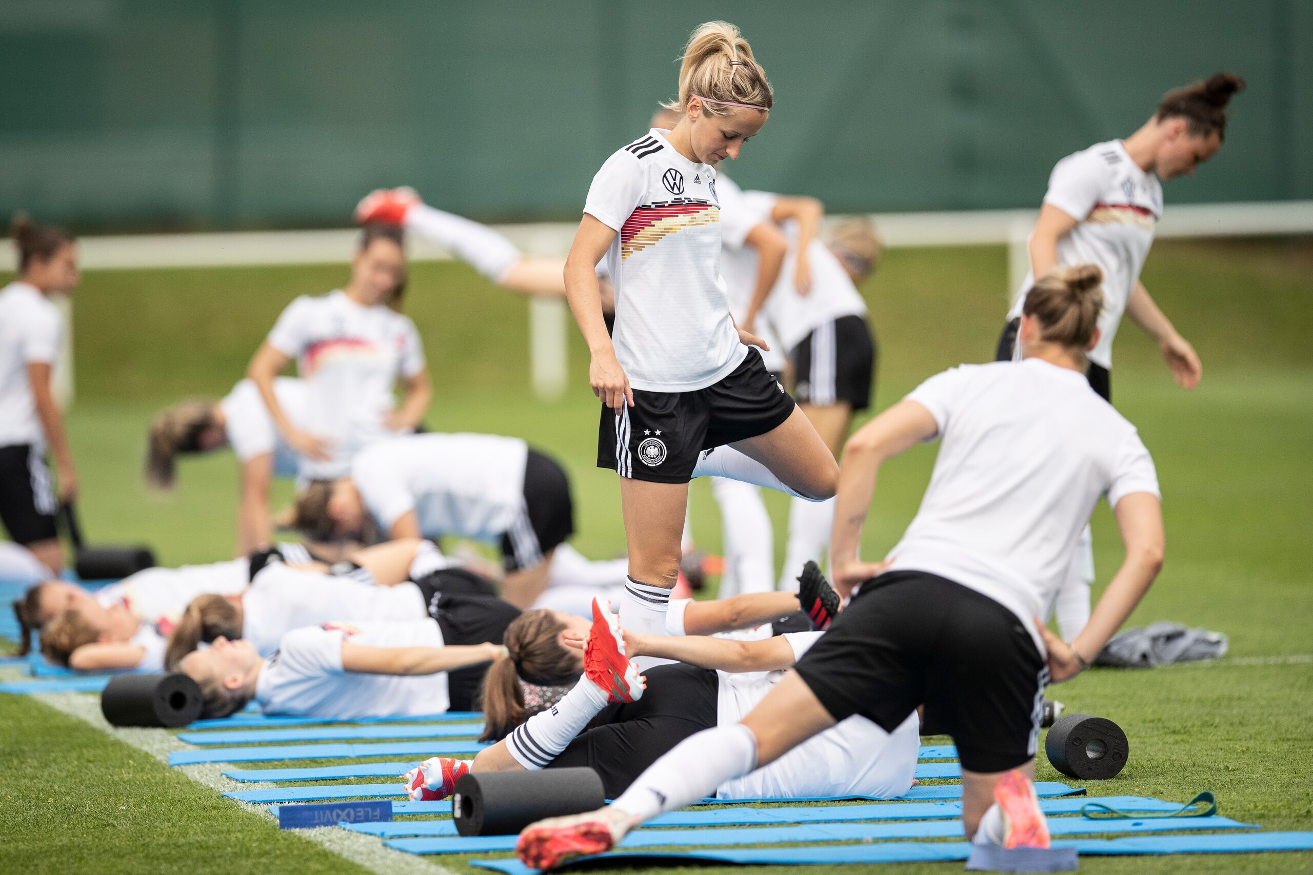 RENNES, FRANCE - JUNE 26: Kathrin Hendrich (C) of Germany and players warm up during a training session on June 26, 2019 in Pont-Pean near Rennes, France. (Photo by Maja Hitij/Getty Images)
