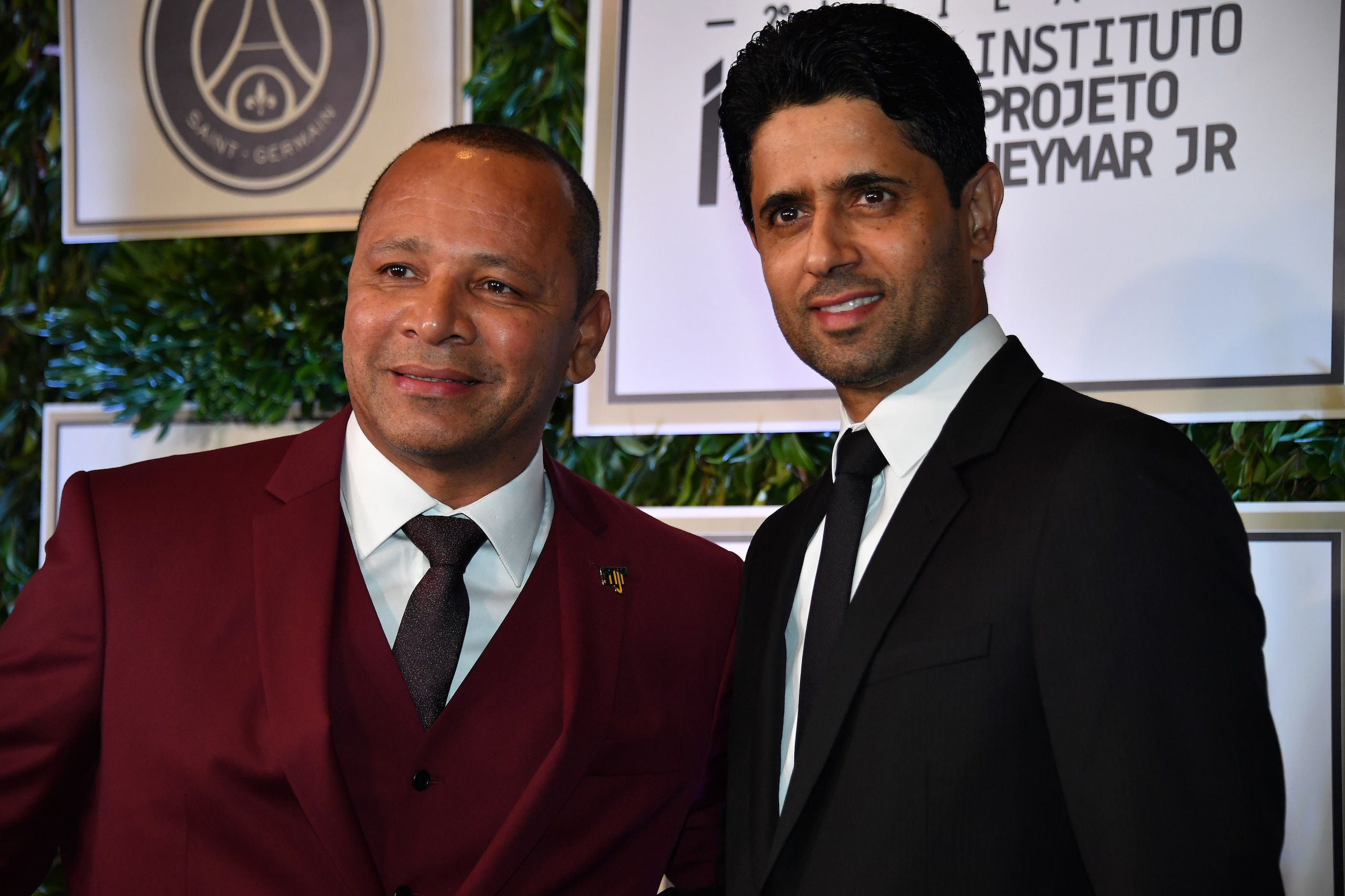 French football team Paris Saint-Germain's (PSG) Qatari president Nasser Al-Khelaifi (R) and Neymar Santos, father of Brazilian superstar and PSG's footballer Neymar Junior, arrive to participate in the charity auction for the Neymar Jr. Institute in Sao 