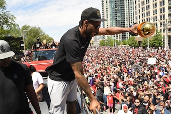 TORONTO, ON - JUNE 17:  Kawhi Leonard #2 of the Toronto Raptors interacts with the crowd during the Toronto Raptors Championship Victory Parade on June 17, 2019 in Toronto, Ontario. NOTE TO USER: User expressly acknowledges and agrees that, by downloading