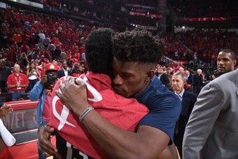 HOUSTON, TX - APRIL 25: James Harden #13 of the Houston Rockets and Jimmy Butler #23 of the Minnesota Timberwolves hug after Game Five of the Western Conference Quarterfinals during the 2018 NBA Playoffs on April 25, 2018 at the Toyota Center in Houston,