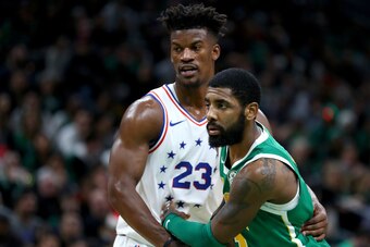 BOSTON, MASSACHUSETTS - DECEMBER 25: Kyrie Irving #11 of the Boston Celtics fights for position against Jimmy Butler #23 of the Philadelphia 76ers during the third quarter at TD Garden on December 25, 2018 in Boston, Massachusetts. NOTE TO USER: User expr