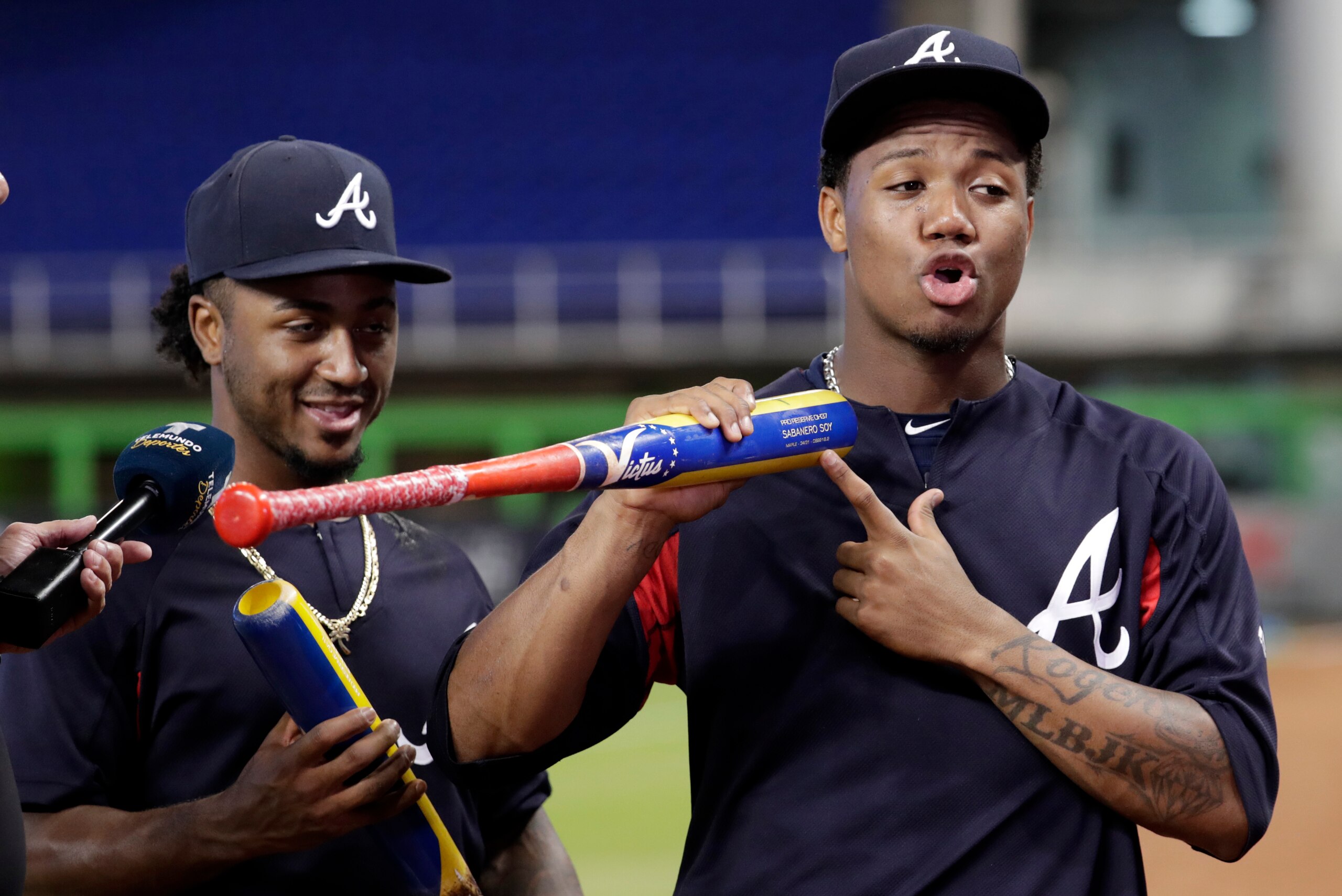 Ronald Acuna Jr. (right) signed a deal with the Braves this past April that could keep him in Atlanta through the 2028 season.