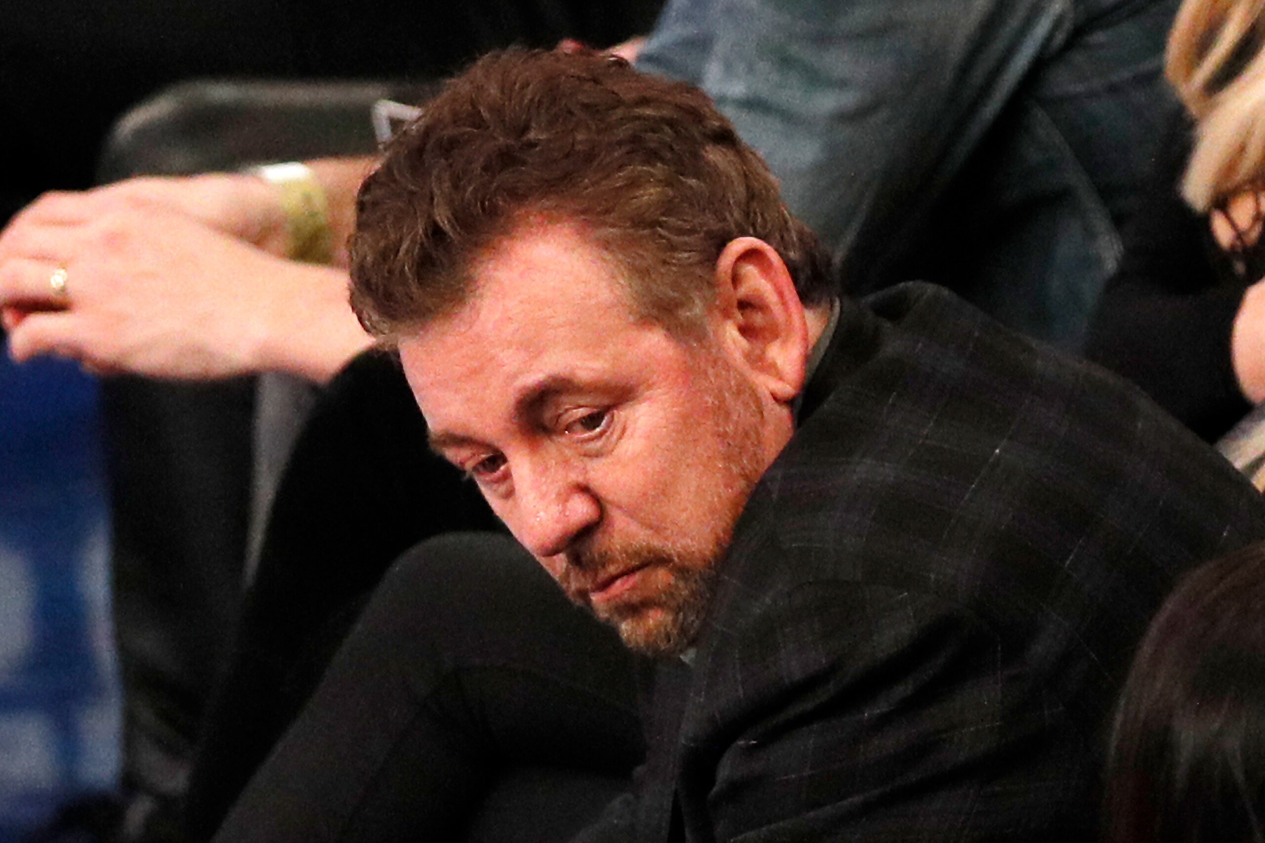NEW YORK, NY - MARCH 28:  New York Knicks owner James Dolan reacts as he watches an NBA basketball game against the Toronto Raptors from his front row seat on March 28, 2019 at Madison Square Garden Center in New York City. Raptors won 117-92. NOTE TO USE