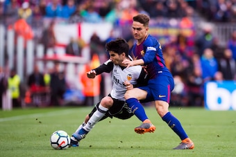 BARCELONA, SPAIN - APRIL 14:  Denis Suarez of FC Barcelona fights for the ball with Carlos Soler of Valencia CF during the La Liga match between Barcelona and Valencia at Camp Nou on April 14, 2018 in Barcelona, Spain.  (Photo by Alex Caparros/Getty Image