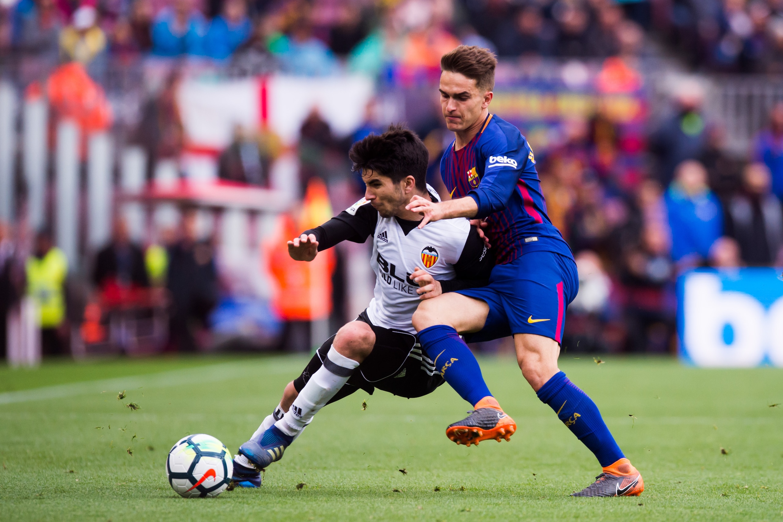 BARCELONA, SPAIN - APRIL 14:  Denis Suarez of FC Barcelona fights for the ball with Carlos Soler of Valencia CF during the La Liga match between Barcelona and Valencia at Camp Nou on April 14, 2018 in Barcelona, Spain.  (Photo by Alex Caparros/Getty Image