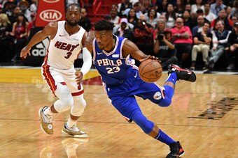 MIAMI, FL - APRIL 09: Dwyane Wade #3 of the Miami Heat in action against Jimmy Butler #23 of the Philadelphia 76ers during the final regular season home game of his career at American Airlines Arena on April 09, 2019 in Miami, Florida. NOTE TO USER: User 