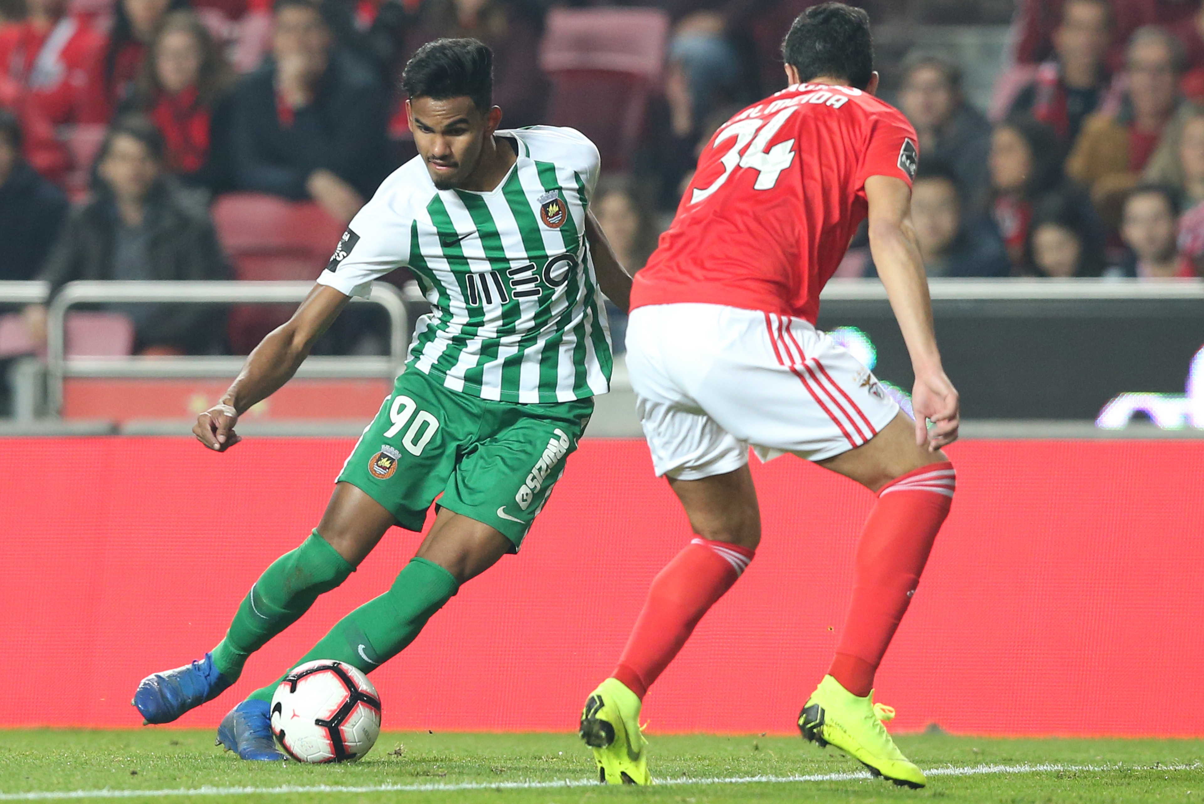 LISBON, PORTUGAL - JANUARY 6:  Wenderson Galeno of Rio Ave FC with Andre Almeida of SL Benfica in action during the Liga NOS match between SL Benfica and Rio Ave FC at Estadio da Luz on January 6, 2019 in Lisbon, Portugal.  (Photo by Gualter Fatia/Getty I