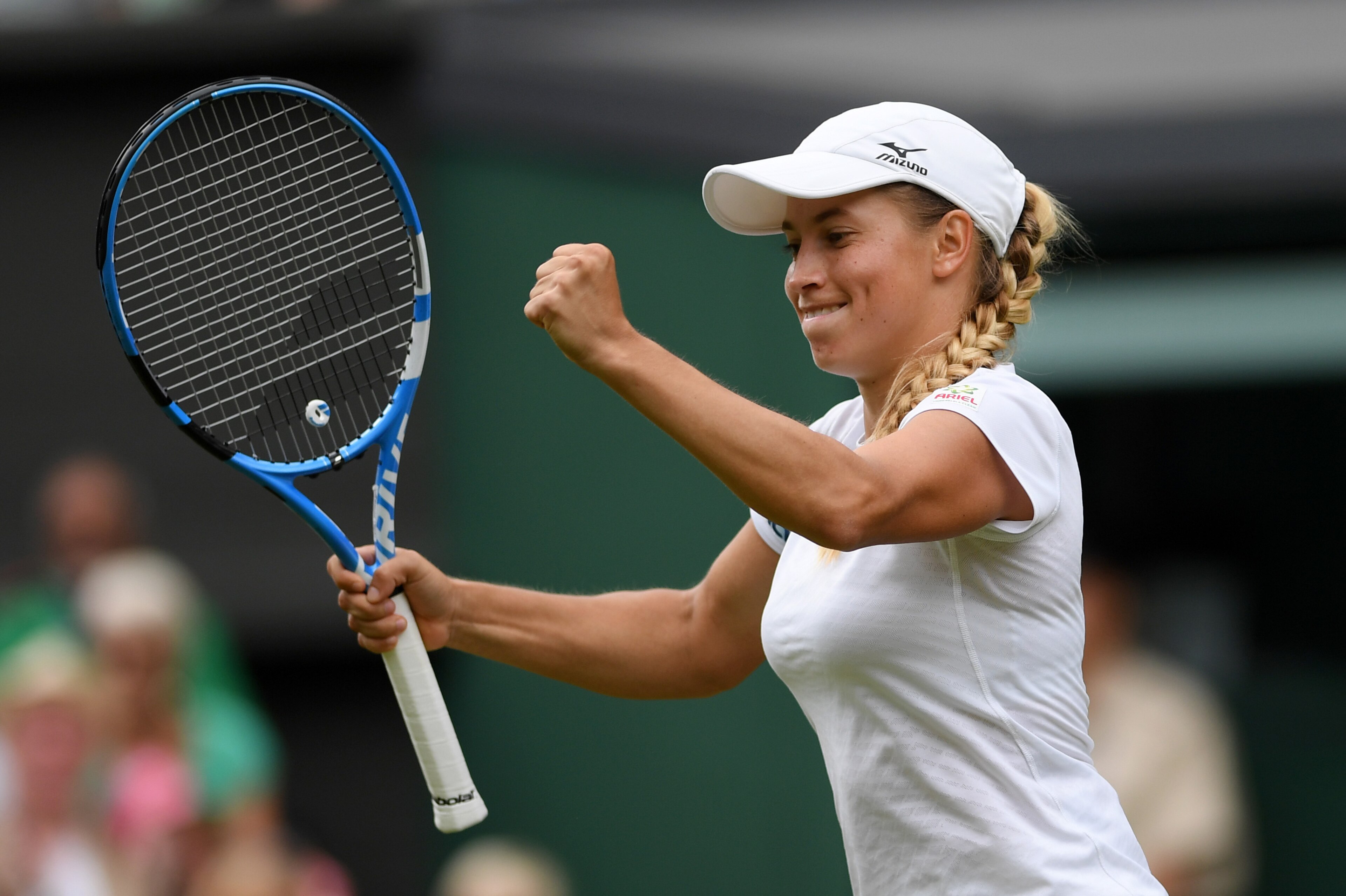 LONDON, ENGLAND - JULY 01: Yulia Putintseva of Kazakhstan celebrates a point in her Ladies' Singles first round match against Naomi Osaka of Japan during Day one of The Championships - Wimbledon 2019 at All England Lawn Tennis and Croquet Club on July 01,