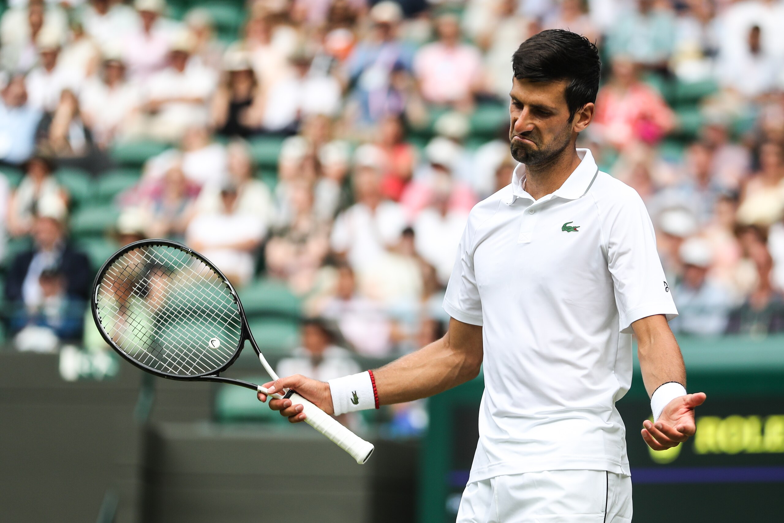 LONDON, ENGLAND - JULY 05: Novak Djokovic of Serbia reacts in his Men's Singles third round match against Hubert Hurkacz of Poland during Day five of The Championships - Wimbledon 2019 at All England Lawn Tennis and Croquet Club on July 05, 2019 in London