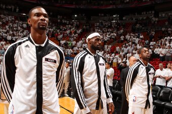 MIAMI, FL - MAY 14: Chris Bosh #1, LeBron James #6, and Dwyane Wade #3 of the Miami Heat stand during the National Anthem before Game Five of the Eastern Conference Semifinals against the Brooklyn Nets during the 2014 NBA playoffs at American Airlines Are