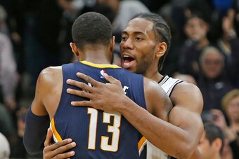 SAN ANTONIO,TX - MARCH 1:  Kawhi Leonard #2 of the San Antonio Spurs hugs Paul George #13 of the Indiana Pacers at the end of the game at AT&T Center on March 1, 2017 in San Antonio, Texas.  NOTE TO USER: User expressly acknowledges and agrees that , by d