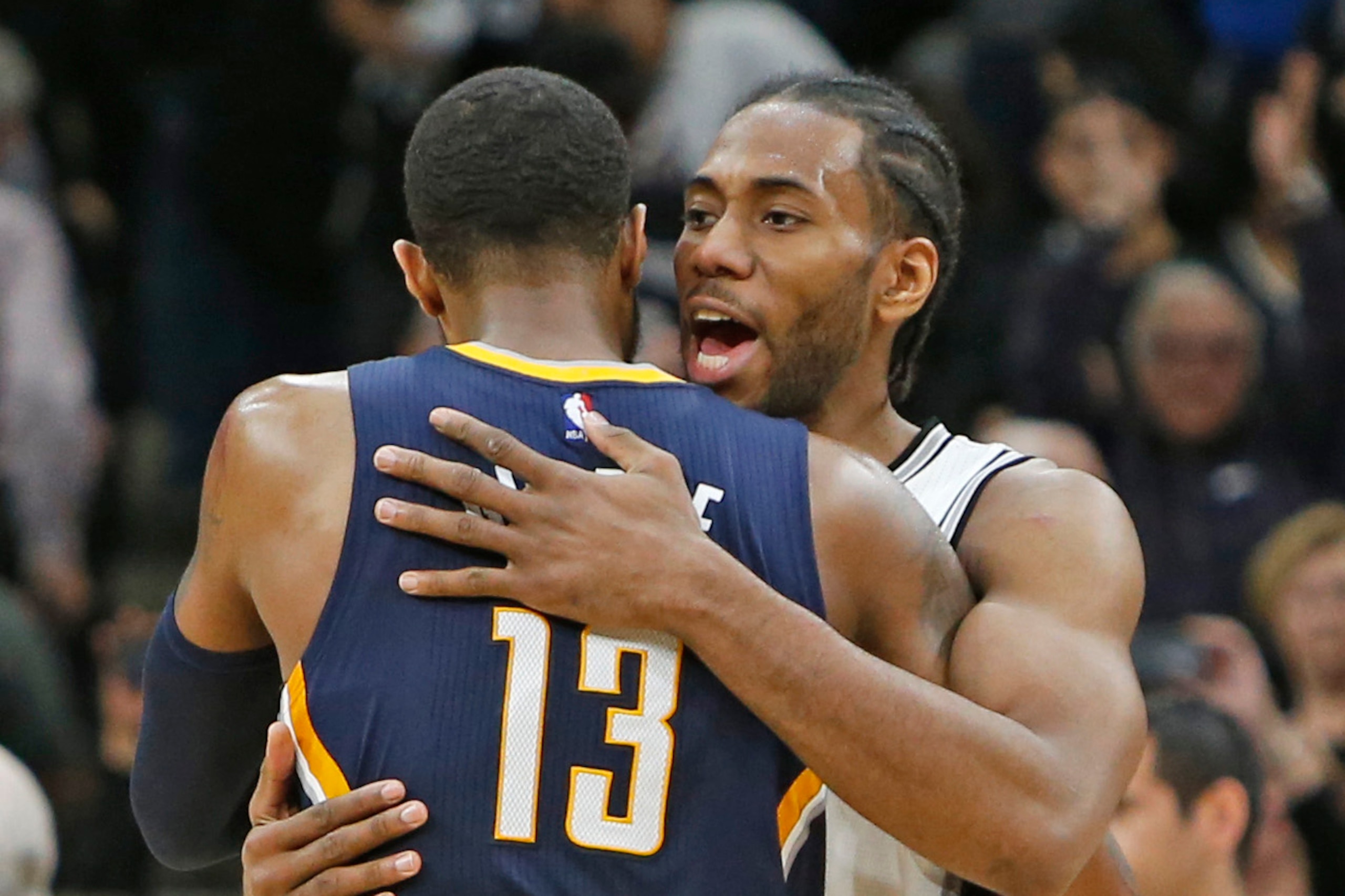 SAN ANTONIO,TX - MARCH 1:  Kawhi Leonard #2 of the San Antonio Spurs hugs Paul George #13 of the Indiana Pacers at the end of the game at AT&T Center on March 1, 2017 in San Antonio, Texas.  NOTE TO USER: User expressly acknowledges and agrees that , by d