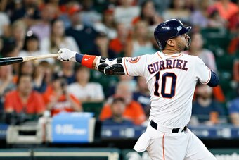 HOUSTON, TEXAS - JULY 07: Yuli Gurriel #10 of the Houston Astros hits a grand slam in the sixth inning against the Los Angeles Angels of Anaheim at Minute Maid Park on July 07, 2019 in Houston, Texas. (Photo by Bob Levey/Getty Images)