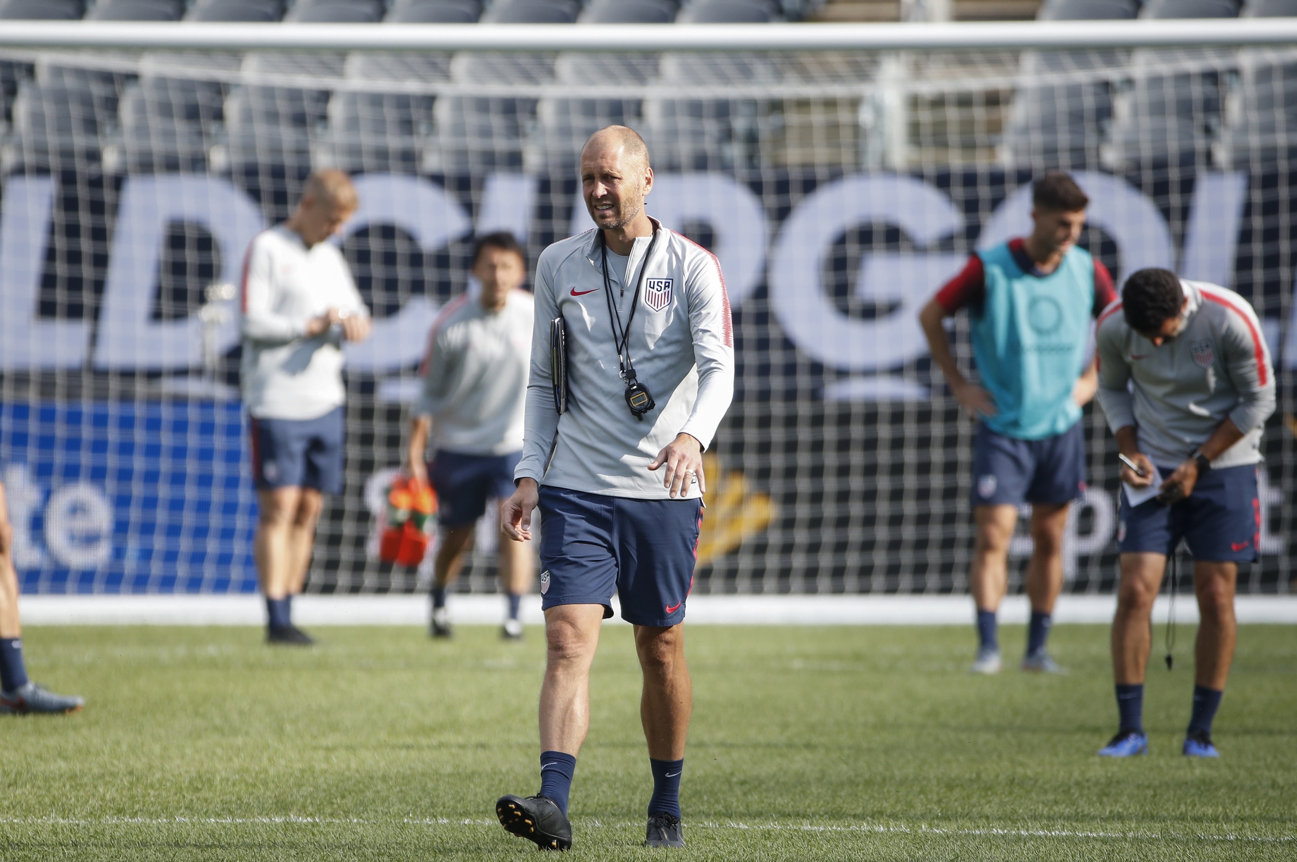 United States head coach Gregg Berhalter (C) walks on the field during a training session at Soldier Field on July 6, 2019 in Chicago, Illinois, a day before the 2019 Concacaf Gold Cup final between Mexico and United States. (Photo by KAMIL KRZACZYNSKI / 
