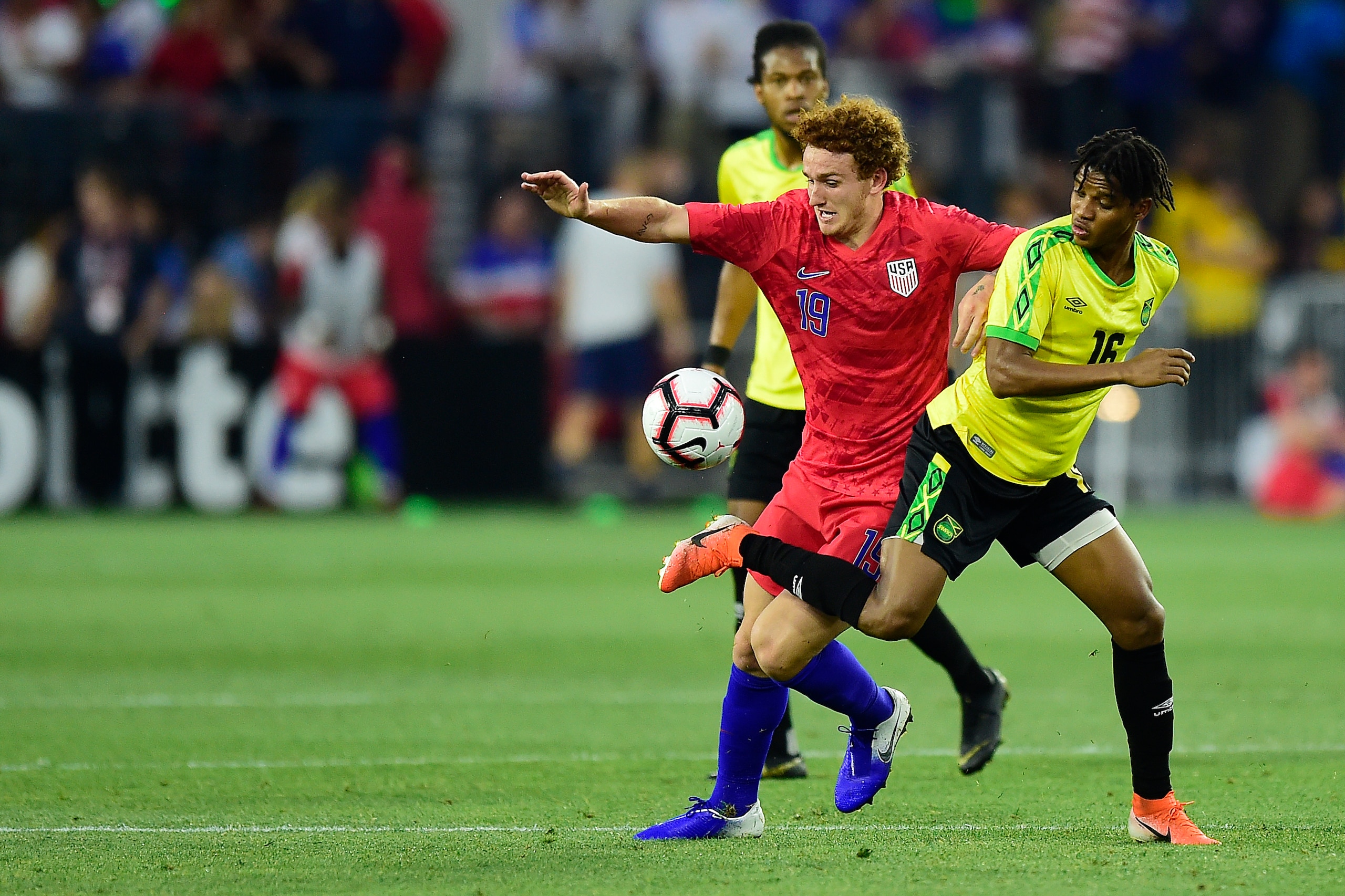 WASHINGTON, DC - JUNE 05: Josh Sargent #19 of the United States and Peter Vassell #16 of Jamaica battle for the ball in the second half during an International Friendly at Audi Field on June 5, 2019 in Washington, DC. (Photo by Patrick McDermott/Getty Ima