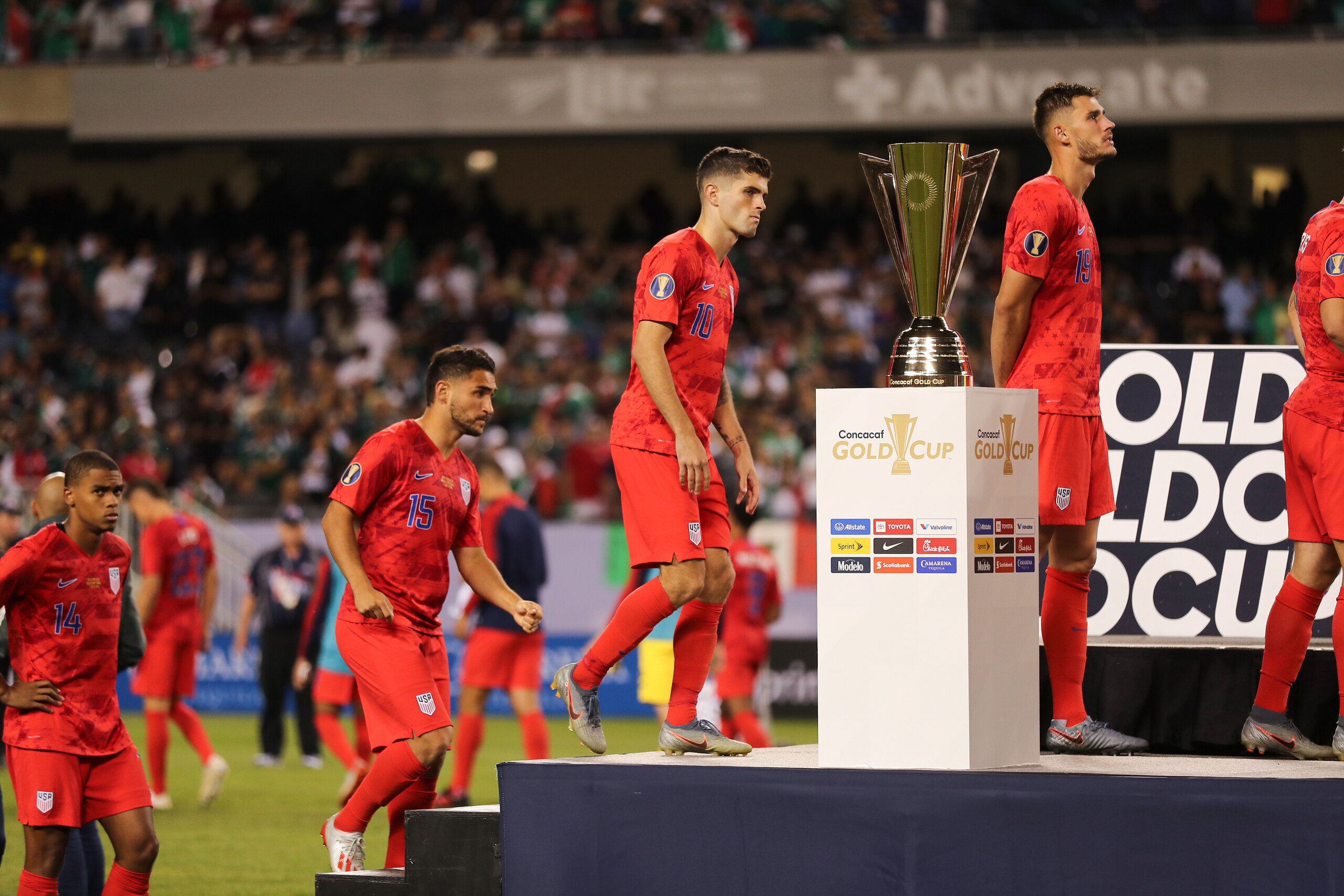 CHICAGO, IL - JULY 07: Christian Pulisic of USA walks past the CONCACAF Gold Cup trophy after USA's 0-1 defeat to Mexico in the 2019 CONCACAF Gold Cup Final between Mexico and United States of America at Soldier Field on July 7, 2019 in Chicago, Illinois.