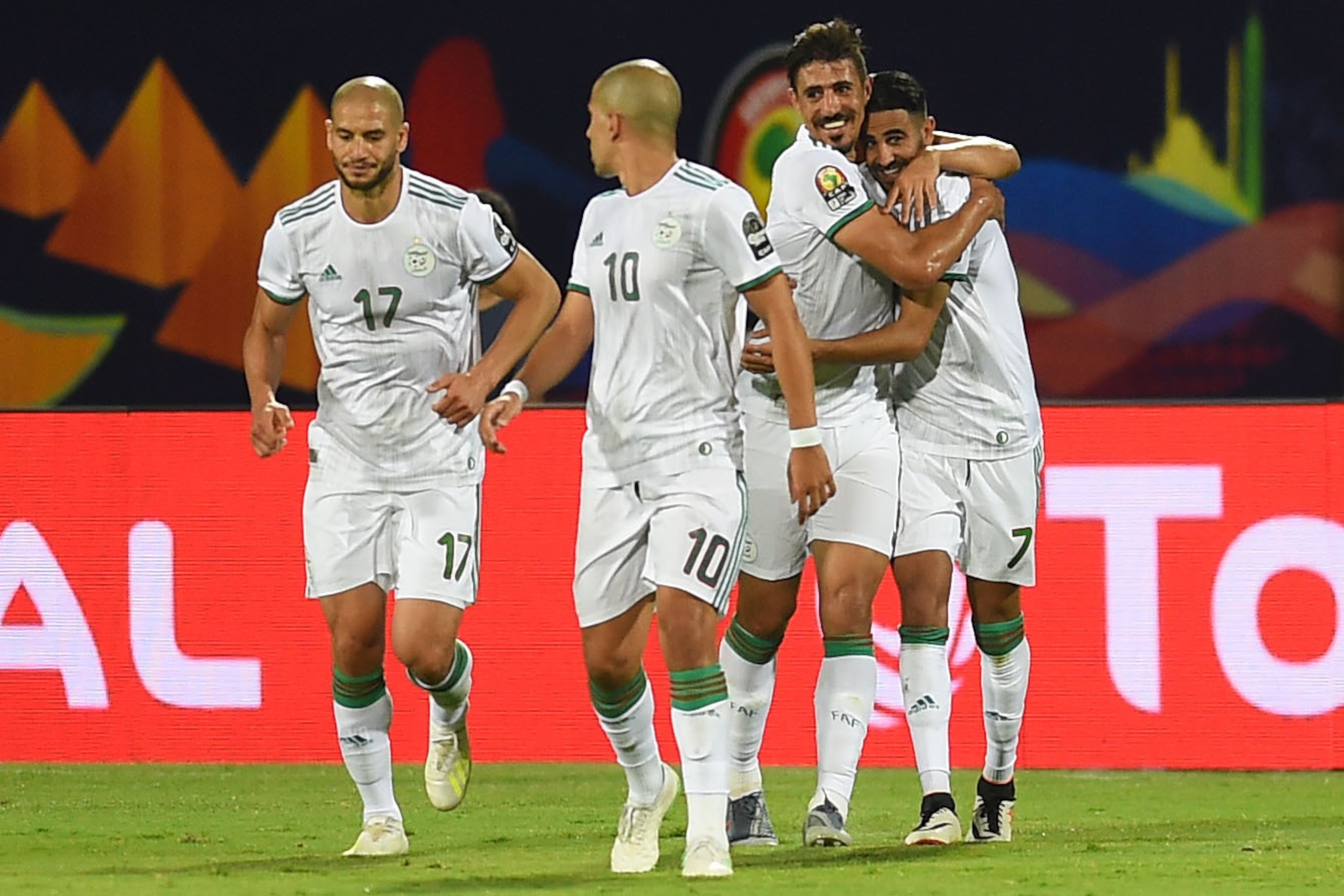 Algeria's forward Riyad Mahrez (1st-R) celebrates after scoring a goal during the 2019 Africa Cup of Nations (CAN) Round of 16 football match between Algeria and Guinea at the 30 June Stadium in the Egyptian capital Cairo on July 7, 2019. (Photo by MOHAME Algeria's forward Riyad Mahrez (1st-R) celebrates after scoring a goal during the 2019 Africa Cup of Nations (CAN) Round of 16 football match between Algeria and Guinea at the 30 June Stadium in the Egyptian capital Cairo on July 7, 2019. (Photo by MOHAME