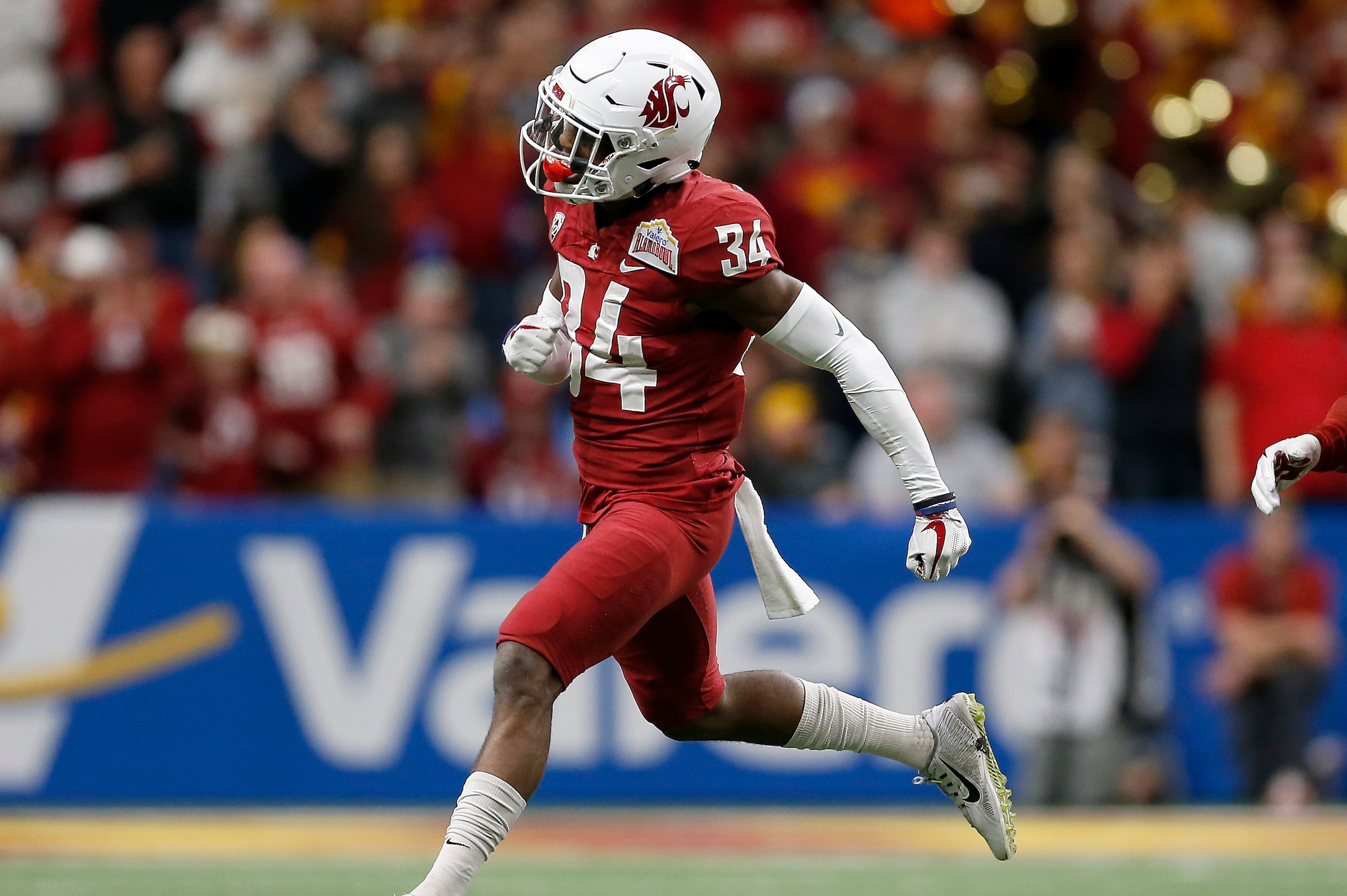 SAN ANTONIO, TX - DECEMBER 28:  Jalen Thompson #34 of the Washington State Cougars and Jahad Woods #13 celebrate after a turnover in the first half against the Iowa State Cyclones during the Valero Alamo Bowl at the Alamodome on December 28, 2018 in San A
