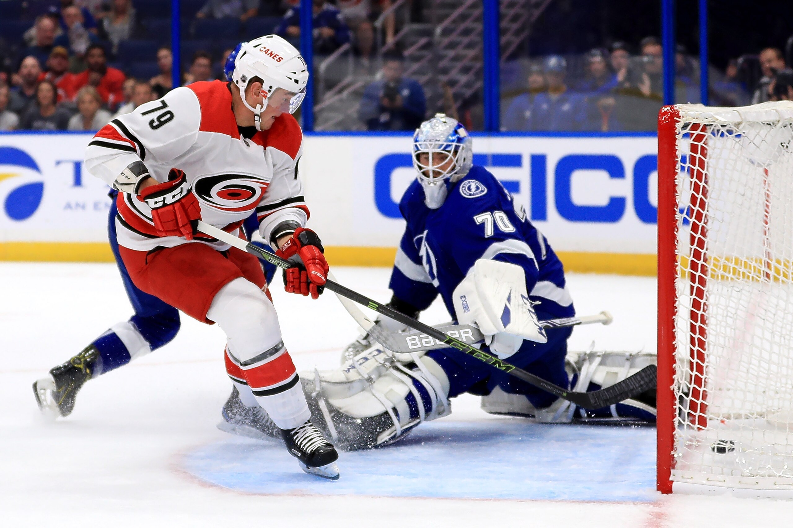 TAMPA, FL - OCTOBER 16:  Micheal Ferland #79 of the Carolina Hurricanes scores on Louis Domingue #70 of the Tampa Bay Lightning during a game  at Amalie Arena on October 16, 2018 in Tampa, Florida.  (Photo by Mike Ehrmann/Getty Images)