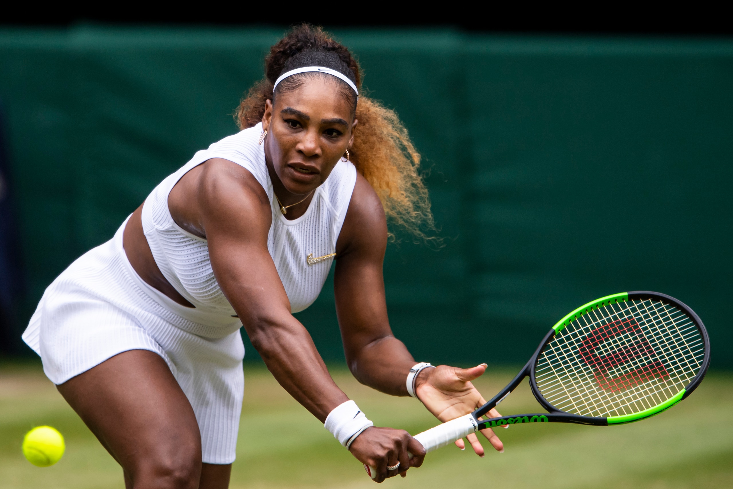 LONDON, ENGLAND - JULY 09: Serena Williams of the United States hits a backhand against Alison Riske of the United States during Day 8 of The Championships - Wimbledon 2019 at All England Lawn Tennis and Croquet Club on July 09, 2019 in London, England. (