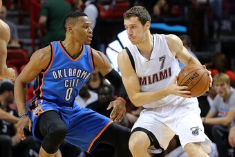 MIAMI, FL - DECEMBER 03: Goran Dragic #7 of the Miami Heat is guarded by Russell Westbrook #0 of the Oklahoma City Thunder during a game  at American Airlines Arena on December 3, 2015 in Miami, Florida. NOTE TO USER: User expressly acknowledges and agree