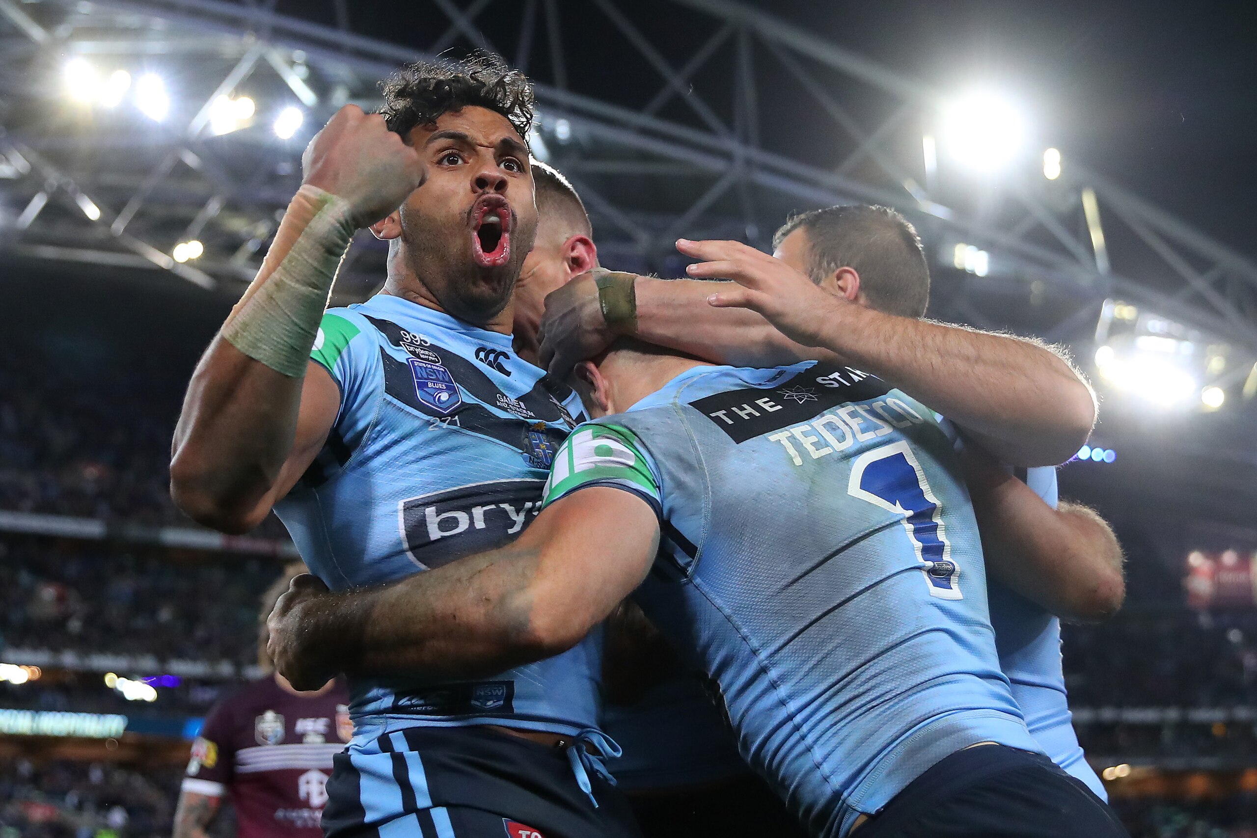 SYDNEY, AUSTRALIA - JULY 10: Josh Addo-Carr of the Blues celebrates after a try scored by James Tedesco of the Blues during game three of the 2019 State of Origin series between the New South Wales Blues and the Queensland Maroons at ANZ Stadium on July SYDNEY, AUSTRALIA - JULY 10: Josh Addo-Carr of the Blues celebrates after a try scored by James Tedesco of the Blues during game three of the 2019 State of Origin series between the New South Wales Blues and the Queensland Maroons at ANZ Stadium on July