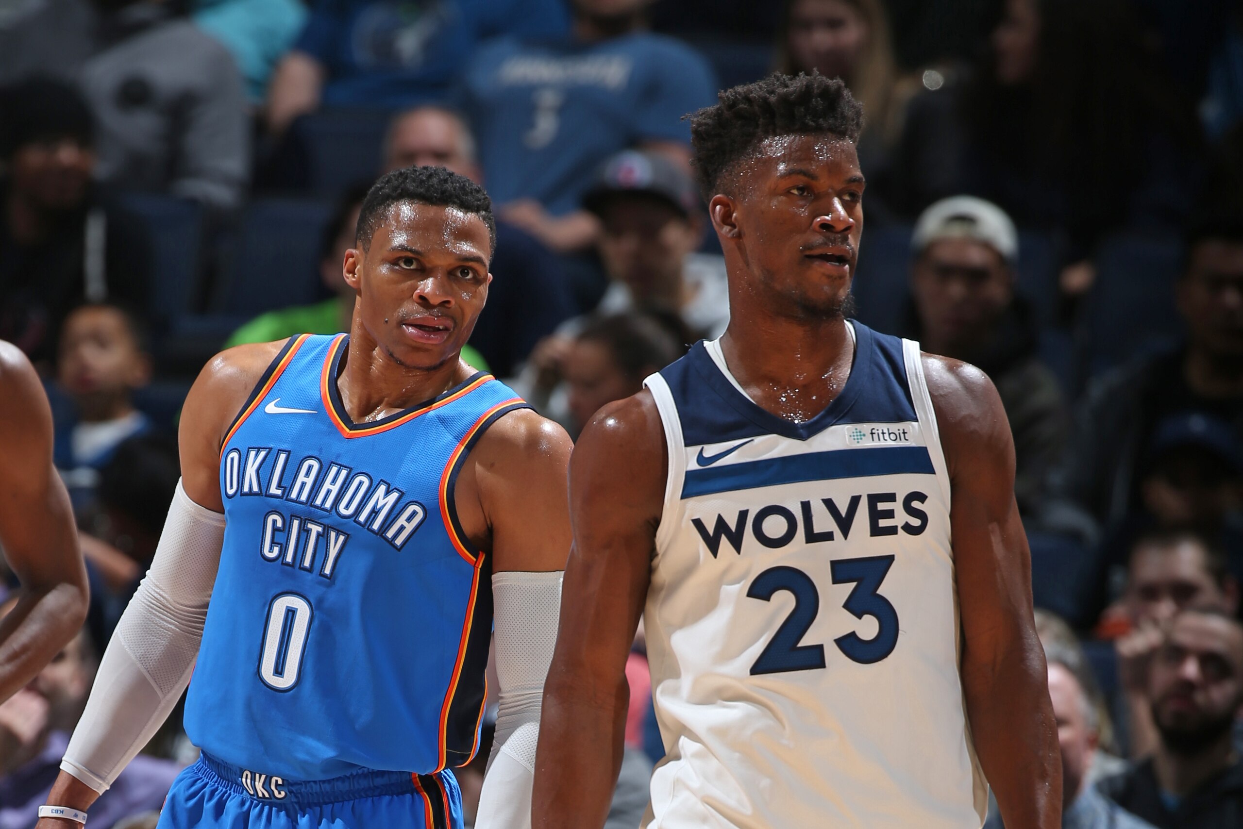 MINNEAPOLIS, MN -  JANUARY 10: Russell Westbrook #0 of the Oklahoma City Thunder and Jimmy Butler #23 of the Minnesota Timberwolves stands on the court during the game on January 10, 2018 at Target Center in Minneapolis, Minnesota. NOTE TO USER: User expr