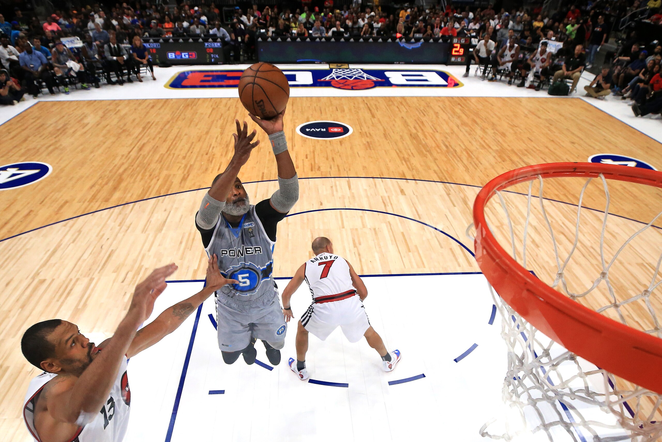 ATLANTA, GEORGIA - JULY 07: Cuttino Mobley #5 of Power shoots past Patrick O’Bryant #13 of Trilogy during week three of the BIG3 three on three basketball league at State Farm Arena on July 07, 2019 in Atlanta, Georgia. (Photo by Andy Lyons/BIG3/Getty Ima