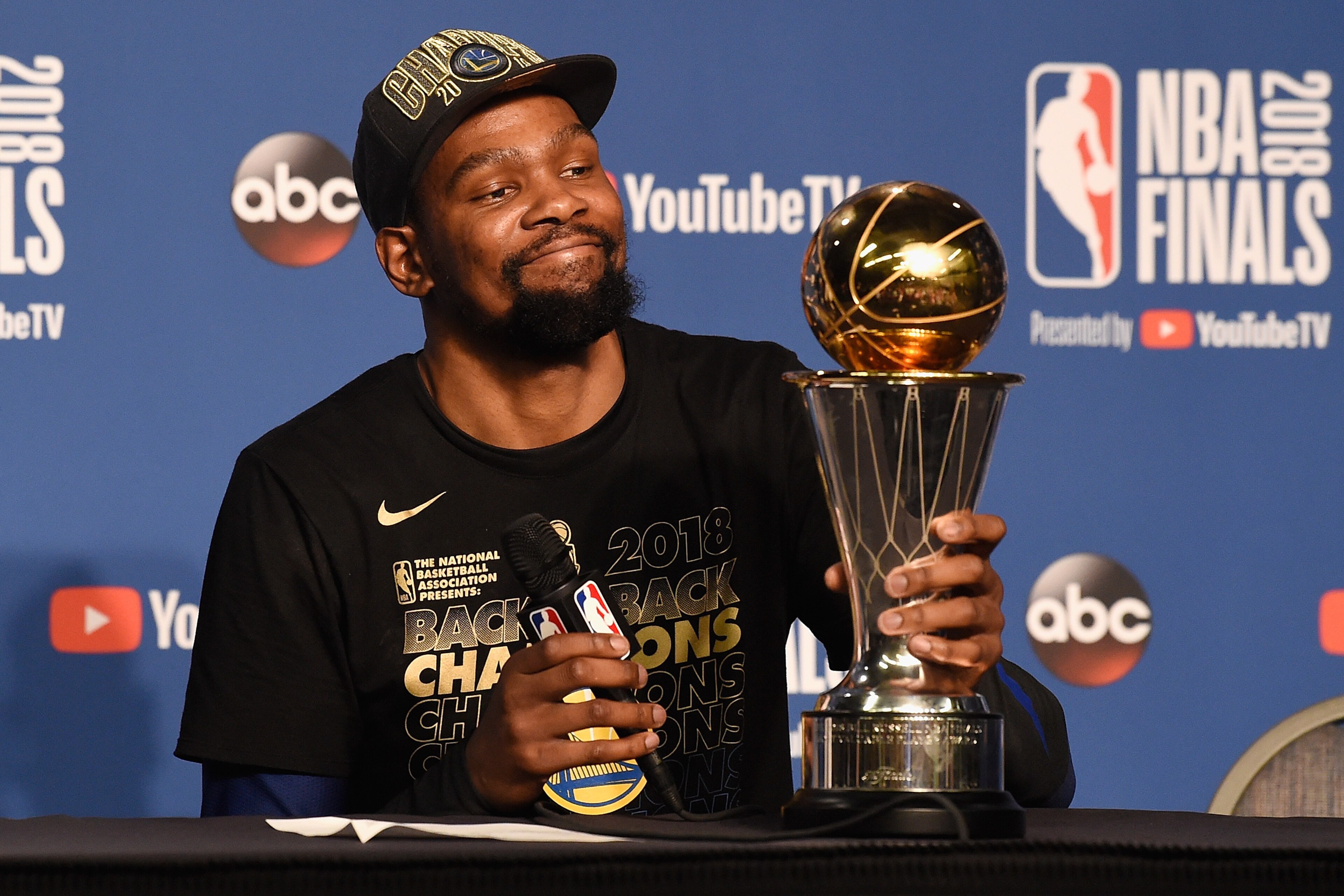 CLEVELAND, OH - JUNE 08:  Finals MVP Kevin Durant #35 of the Golden State Warriors speaks to the media after defeating the Cleveland Cavaliers during Game Four of the 2018 NBA Finals at Quicken Loans Arena on June 8, 2018 in Cleveland, Ohio. The Warriors 