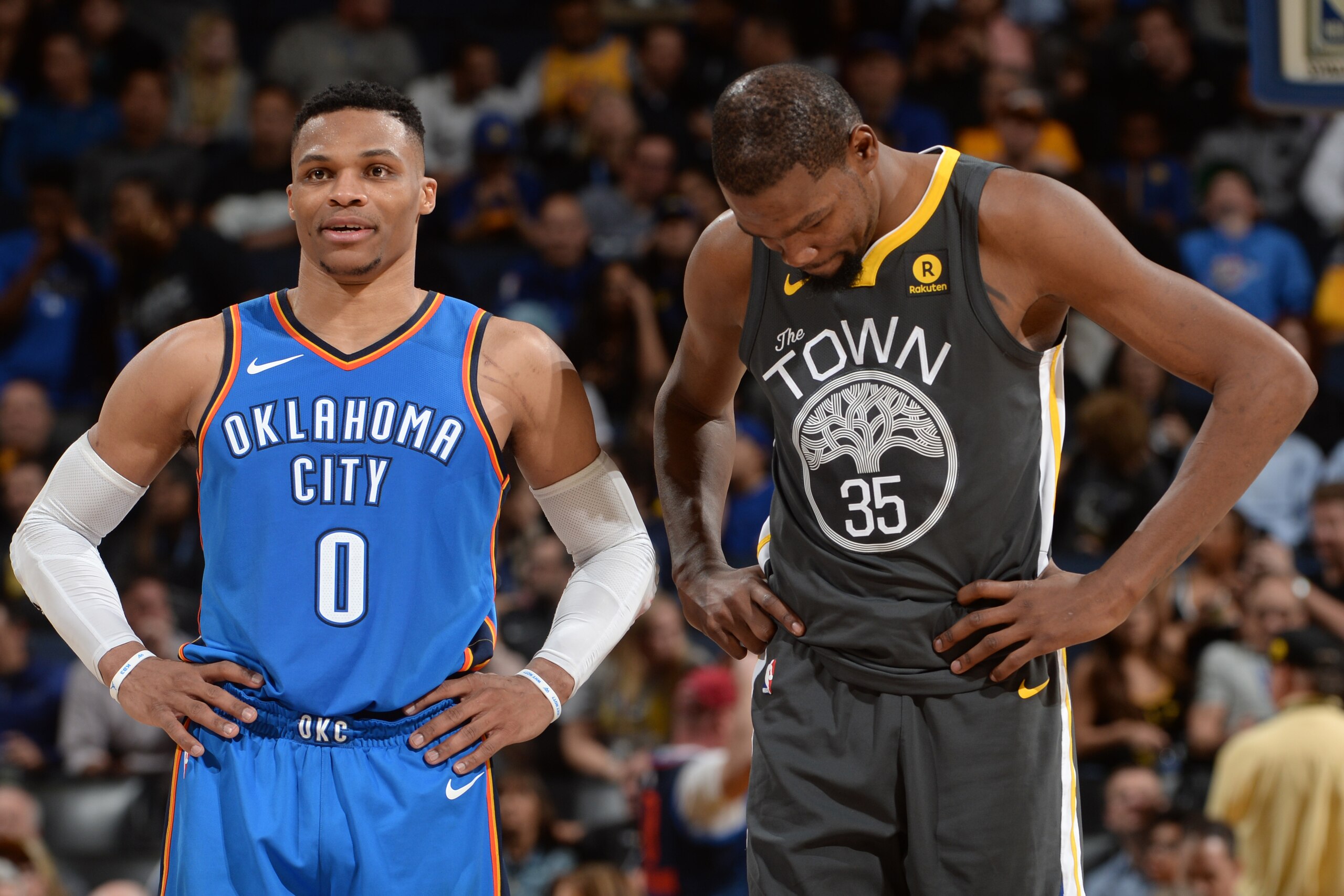 OAKLAND, CA - FEBRUARY 6:  Kevin Durant #35 of the Golden State Warriors and Russell Westbrook #0 of the Oklahoma City Thunder look on during the game on February 6, 2018 at ORACLE Arena in Oakland, California. NOTE TO USER: User expressly acknowledges an