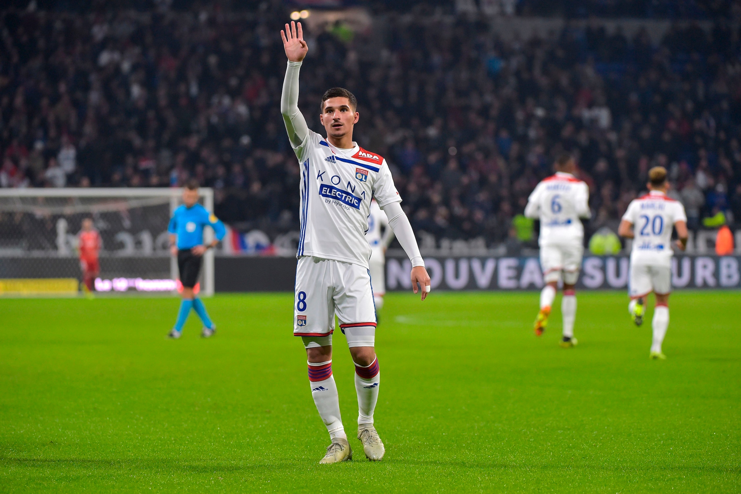 Lyon's French midfielder Houssem Aouar celebrates after scoring a goal during the French L1 football match between Lyon (OL) and Monaco (ASM) on December 16, 2018, at the Groupama Stadium in Decines-Charpieu near Lyon, central-eastern France. (Photo by RO