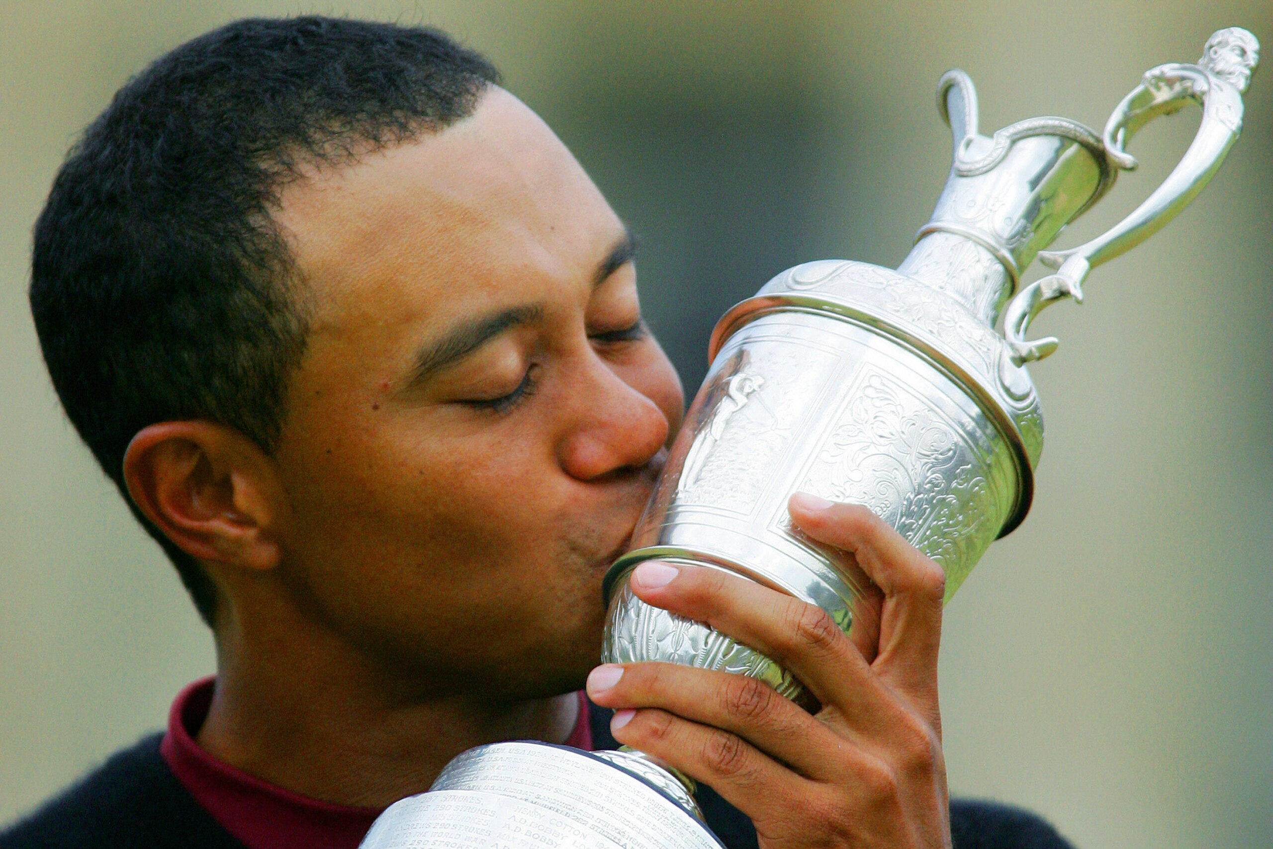 ST. ANDREWS, UNITED KINGDOM: Tiger Woods of the US kisses the Claret Jug after winning the 134th Open Championship on the Old Course in St. Andrews, Scotland, 17 July, 2005. AFP PHOTO/ADRIAN DENNIS (Photo credit should read ADRIAN DENNIS/AFP/Getty Im ST. ANDREWS, UNITED KINGDOM: Tiger Woods of the US kisses the Claret Jug after winning the 134th Open Championship on the Old Course in St. Andrews, Scotland, 17 July, 2005. AFP PHOTO/ADRIAN DENNIS (Photo credit should read ADRIAN DENNIS/AFP/Getty Im