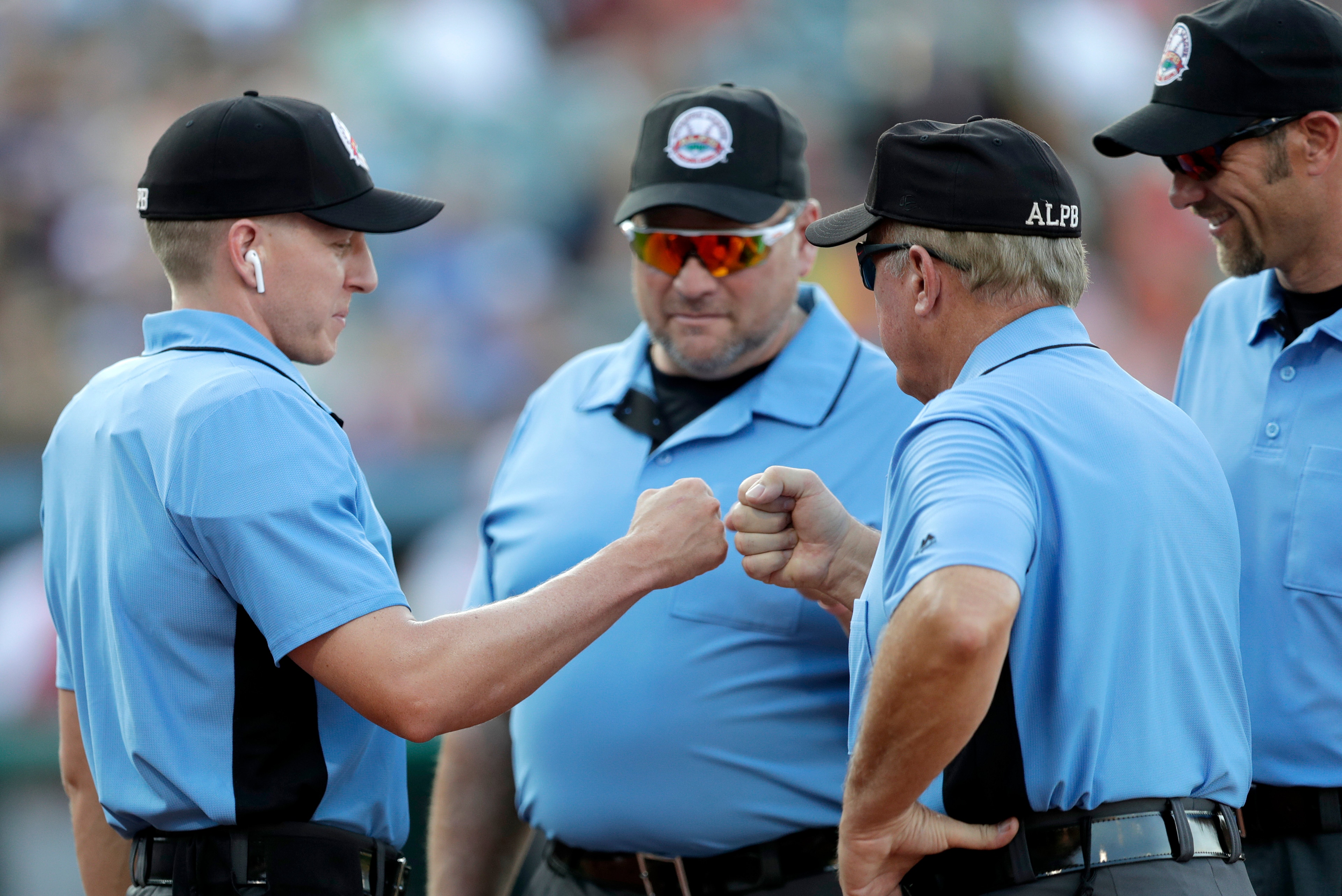Umpire Brian deBrauwere (far left) told the AP before working with the electronic strike zone in the Atlantic League All-Star Game last week, "This is just another plate job and I just get a little help on this one so I feel very relaxed going into this one."