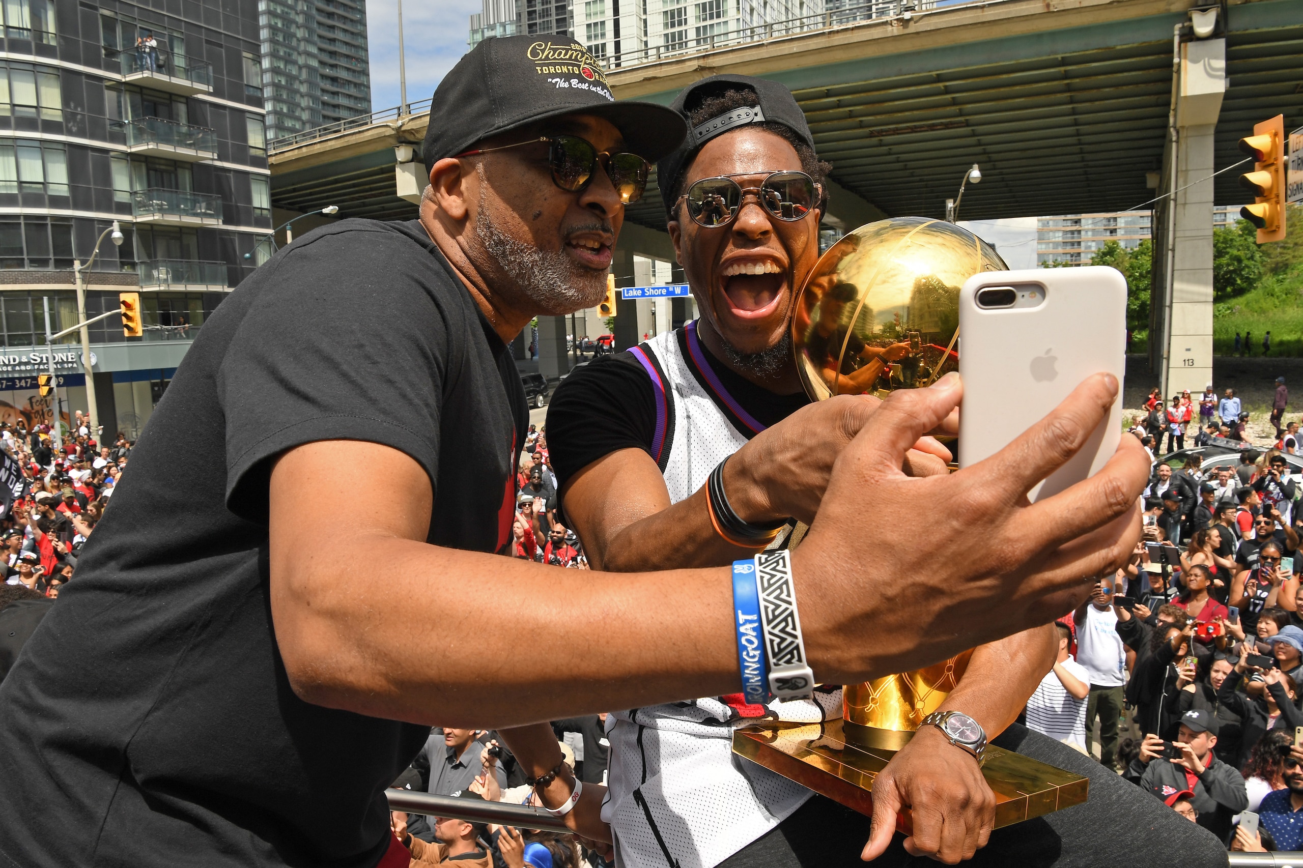 TORONTO, ON - JUNE 17: Assistant Coach Phil Handy and Kyle Lowry #7 of the Toronto Raptors take a selfie during the Toronto Raptors Championship Victory Parade on June 17, 2019 in Toronto, Ontario. NOTE TO USER: User expressly acknowledges and agrees that