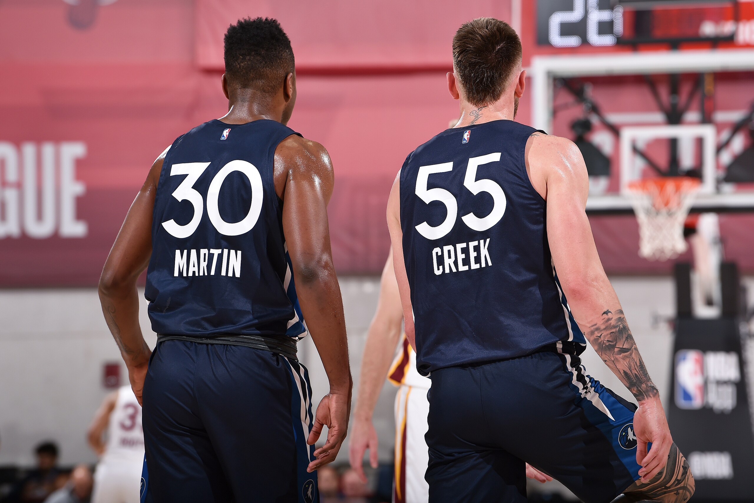 Las Vegas, NV - JULY 5: Kelan Martin #30 of the Minnesota Timberwolves and Mitchell Creek #55 look on during the game against the Cleveland Cavaliers during Day 1 of the 2019 Las Vegas Summer League on July 5, 2019 at the Cox Pavilion in Las Vegas, Nevada