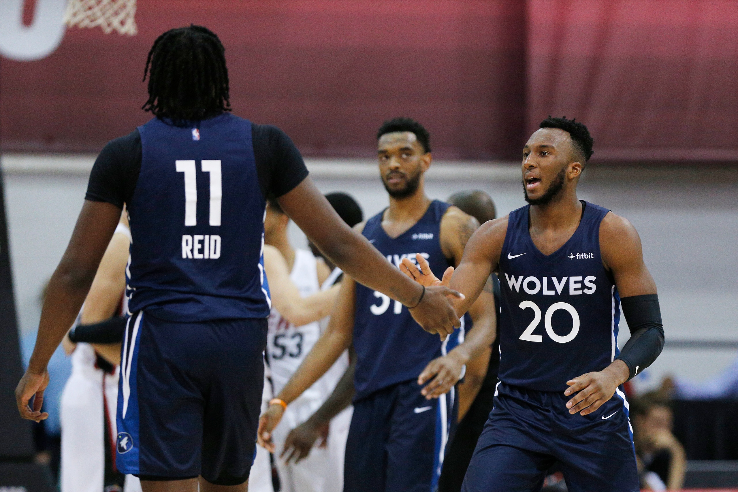 LAS VEGAS, NEVADA - JULY 10: Naz Reid #11 of the Minnesota Timberwolves celebrates with Josh Okogie #20 after a basket against the Miami Heat during the 2019 Summer League at the Cox Pavilion on July 10, 2019 in Las Vegas, Nevada. NOTE TO USER: User expre