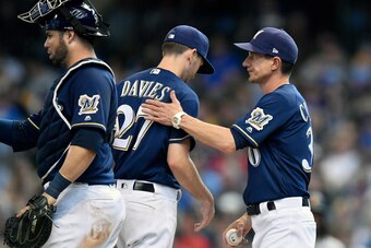 MILWAUKEE, WISCONSIN - JUNE 30: Zach Davies #27 of the Milwaukee Brewers hands to game ball to Craig Counsell #30 of the Milwaukee Brewers after being relieved of pitching against the Pittsburgh Pirates at Miller Park on June 30, 2019 in Milwaukee, Wiscon MILWAUKEE, WISCONSIN - JUNE 30: Zach Davies #27 of the Milwaukee Brewers hands to game ball to Craig Counsell #30 of the Milwaukee Brewers after being relieved of pitching against the Pittsburgh Pirates at Miller Park on June 30, 2019 in Milwaukee, Wiscon