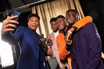 SANTA MONICA, CA - JUNE 24: Kostas Antetokounmpo, Thanasis Antetokounmpo, Alexis Antetokounmpo, and Giannis Antetokounmpo #34 of the Milwaukee Bucks take a selfie with the MVP Trophy during the 2019 NBA Awards Show at the Barker Hangar on June 24, 2019 in