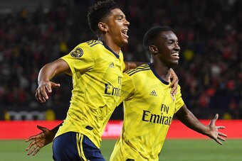 Forward Eddie Nketiah of Arsenal (R) celebrates with teammate Tyreece John-Jules (L) after scoring the winning goal against Bayern Munich during their International Champions Cup football match at the Dignity Health Stadium in Carson, California on July 1