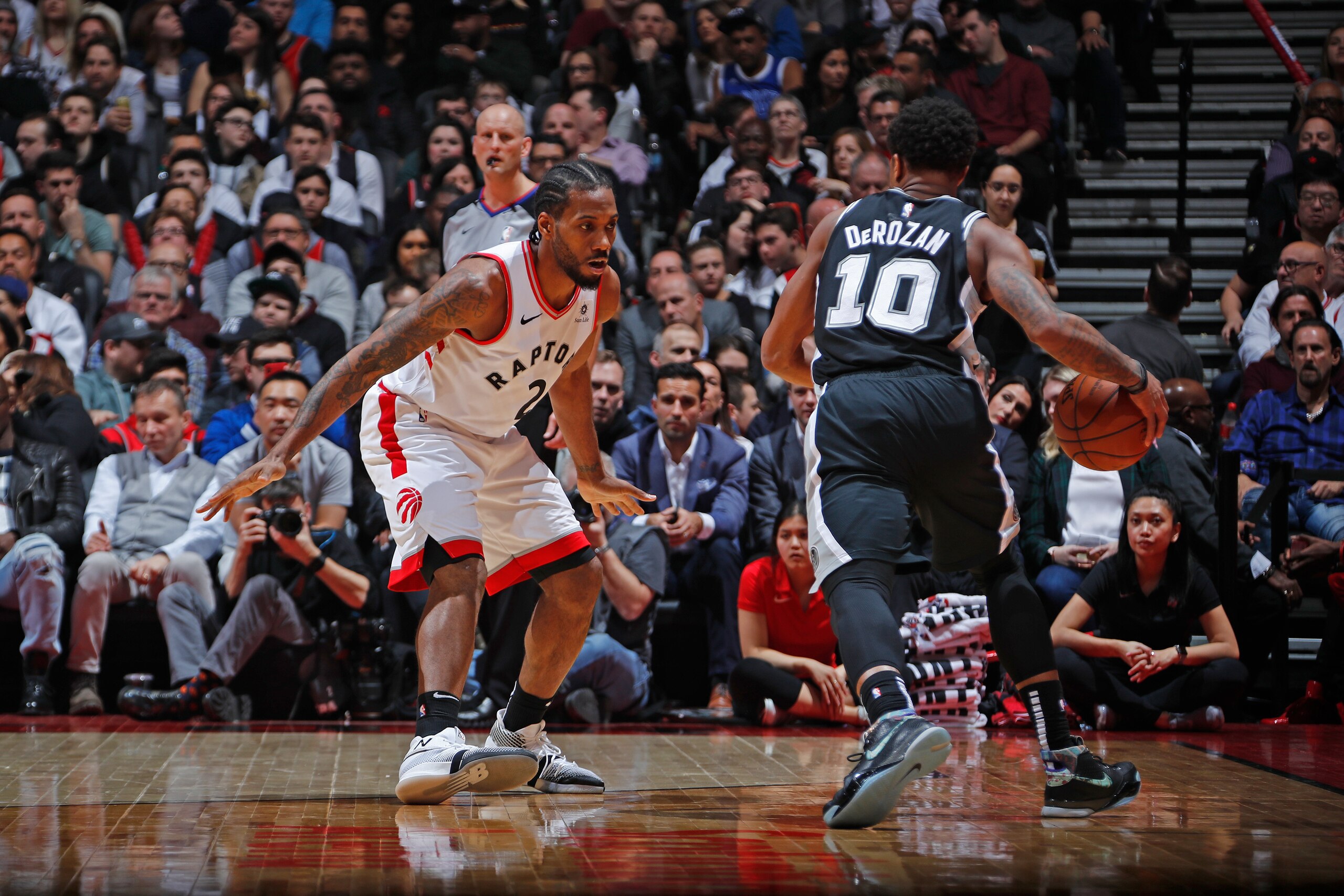 TORONTO, CANADA - FEBRUARY 22:  DeMar DeRozan #10 of the San Antonio Spurs handles the ball against Kawhi Leonard #2 of the Toronto Raptors on February 22, 2019 at the Scotiabank Arena in Toronto, Ontario, Canada.  NOTE TO USER: User expressly acknowledge