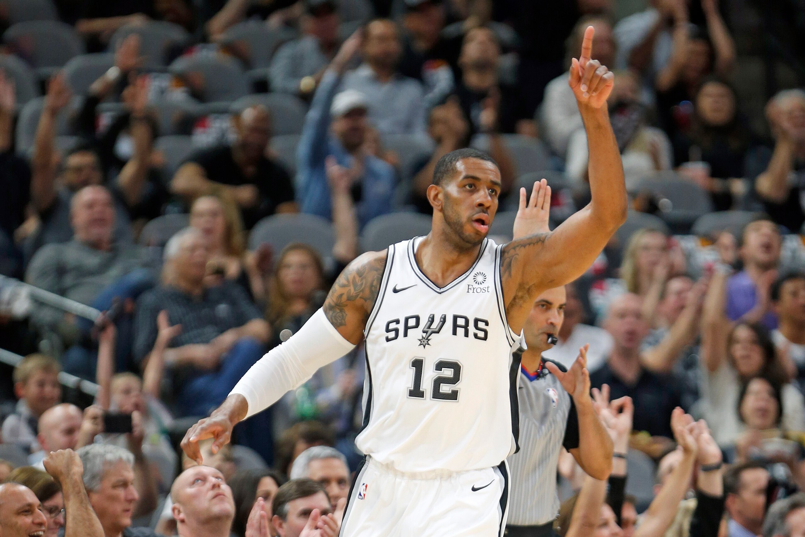 SAN ANTONIO, TX - APRIL 25:  LaMarcus Aldridge #12 of the San Antonio Spurs receives celebration from bench and fans after scoring against the Denver Nuggets during Game Six of the first round of the 2019 NBA Western Conference Playoffs at AT&T Center on 