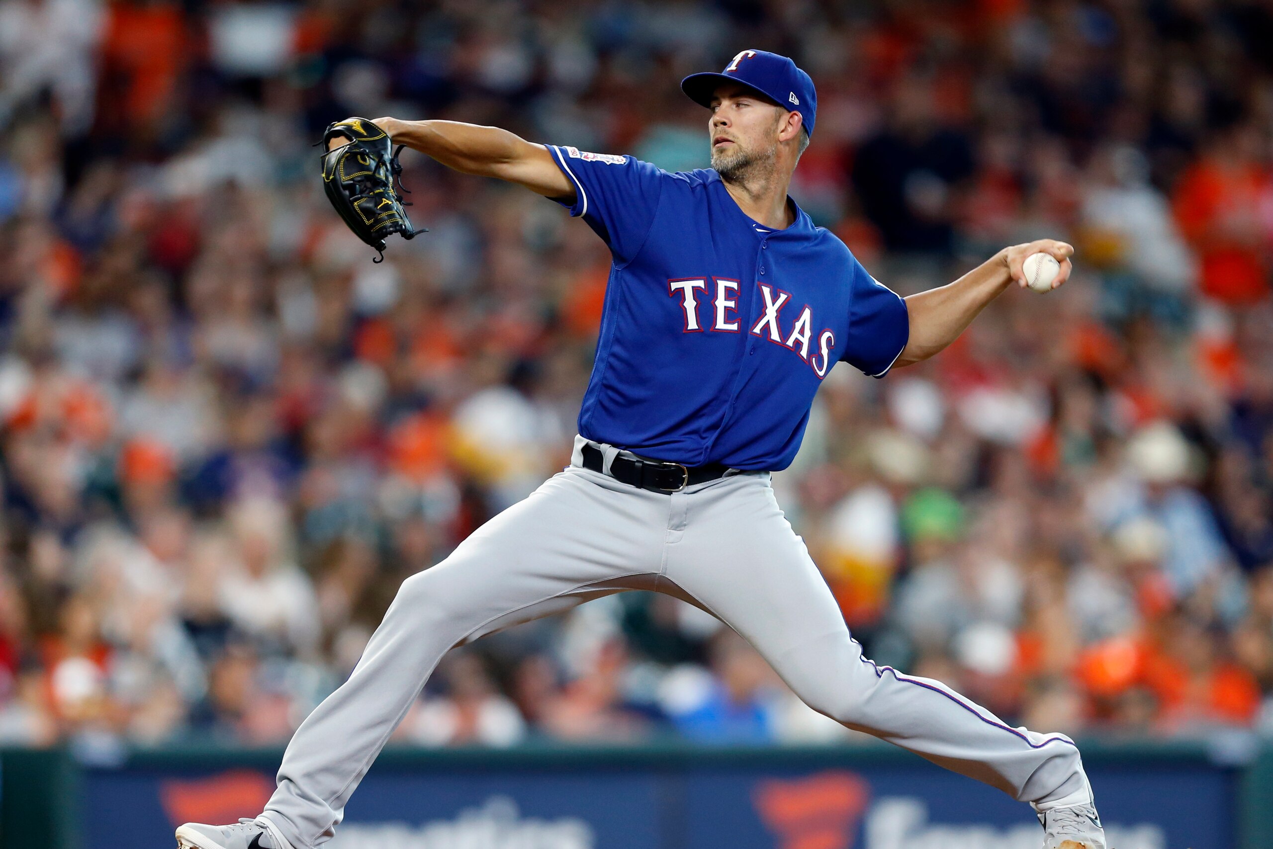 HOUSTON, TEXAS - JULY 19: Mike Minor #23 of the Texas Rangers pitches in the first inning against the Houston Astros at Minute Maid Park on July 19, 2019 in Houston, Texas. (Photo by Bob Levey/Getty Images)
